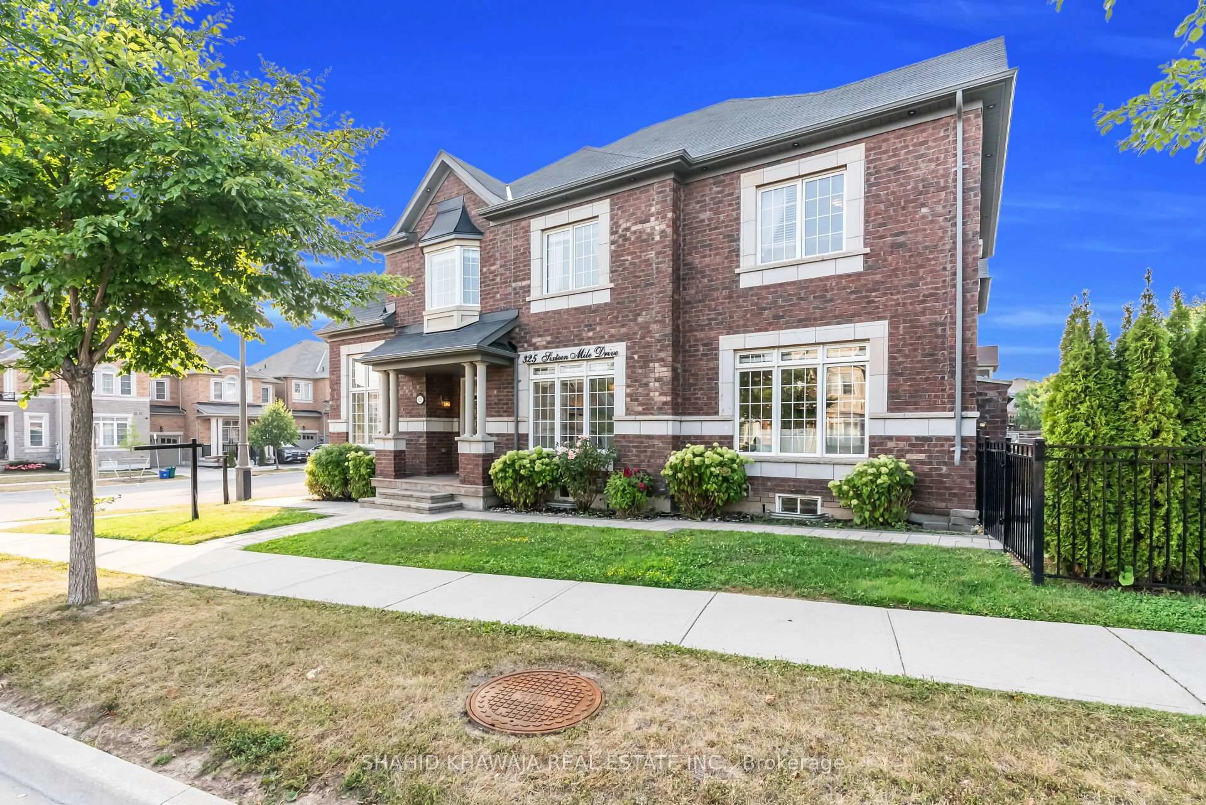 Home with brick exterior material, street for 325 Sixteen Mile Dr, Oakville Ontario L6M 0Z4