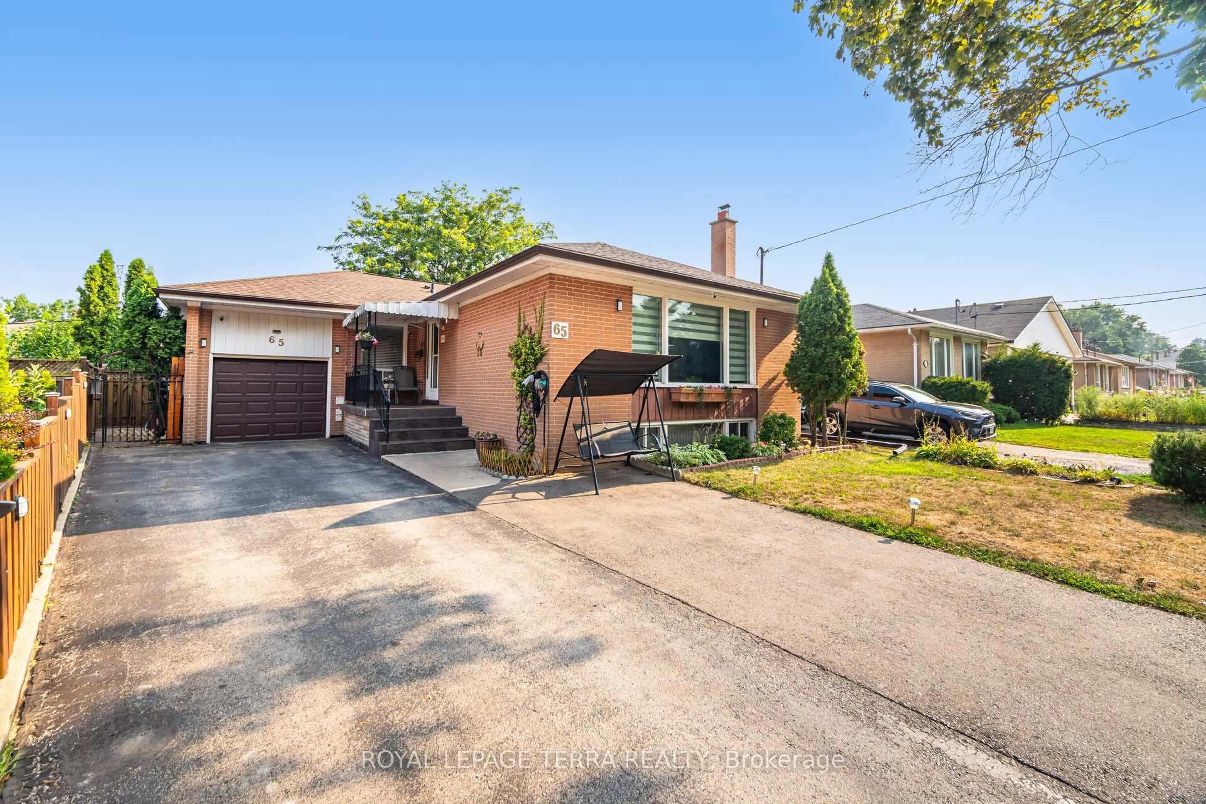 Home with brick exterior material, street for 65 Alhart Dr, Toronto Ontario M9V 2N1