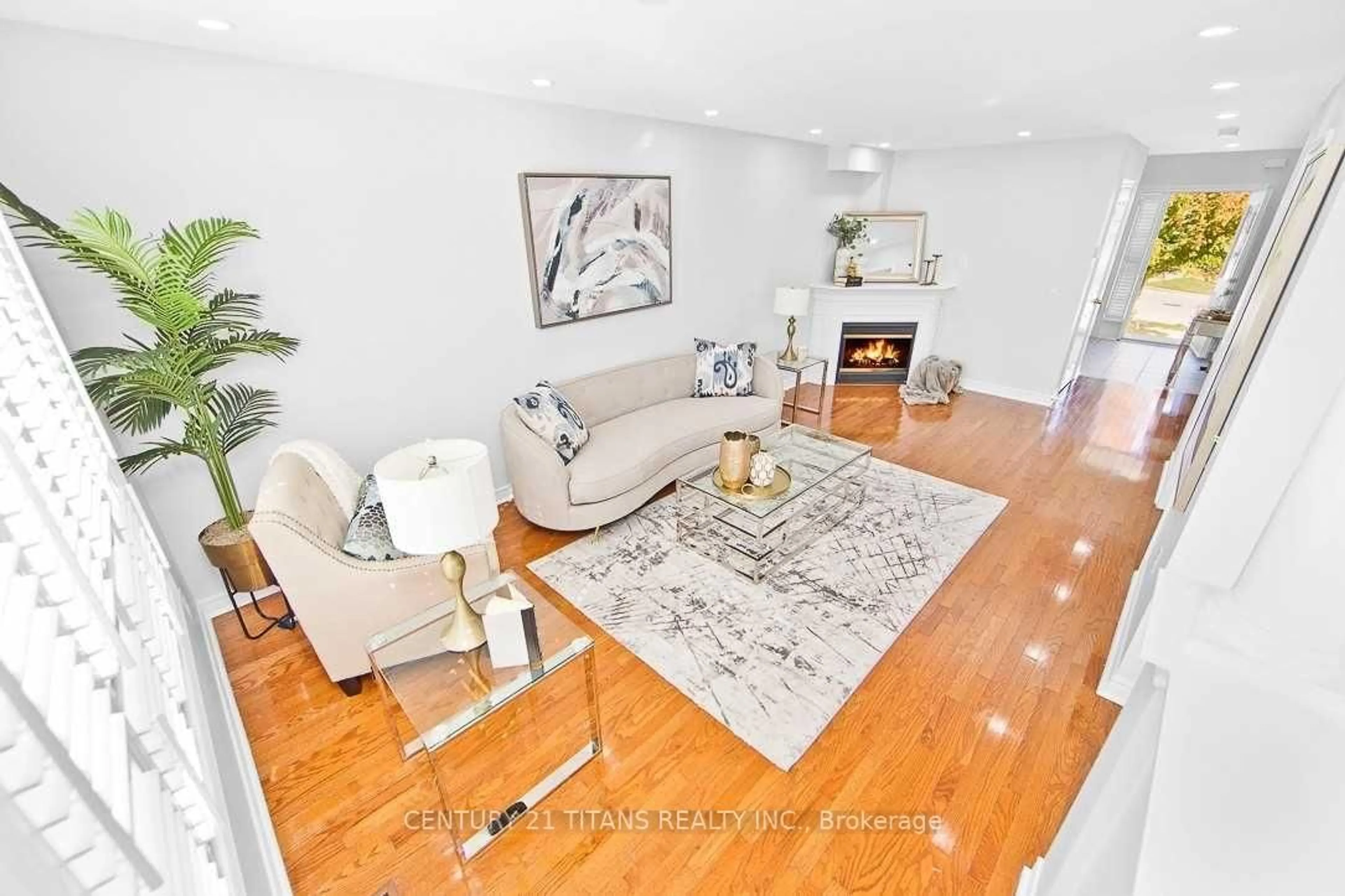 Living room with furniture, wood/laminate floor for 30 Trevino Cres, Brampton Ontario L6P 1L9