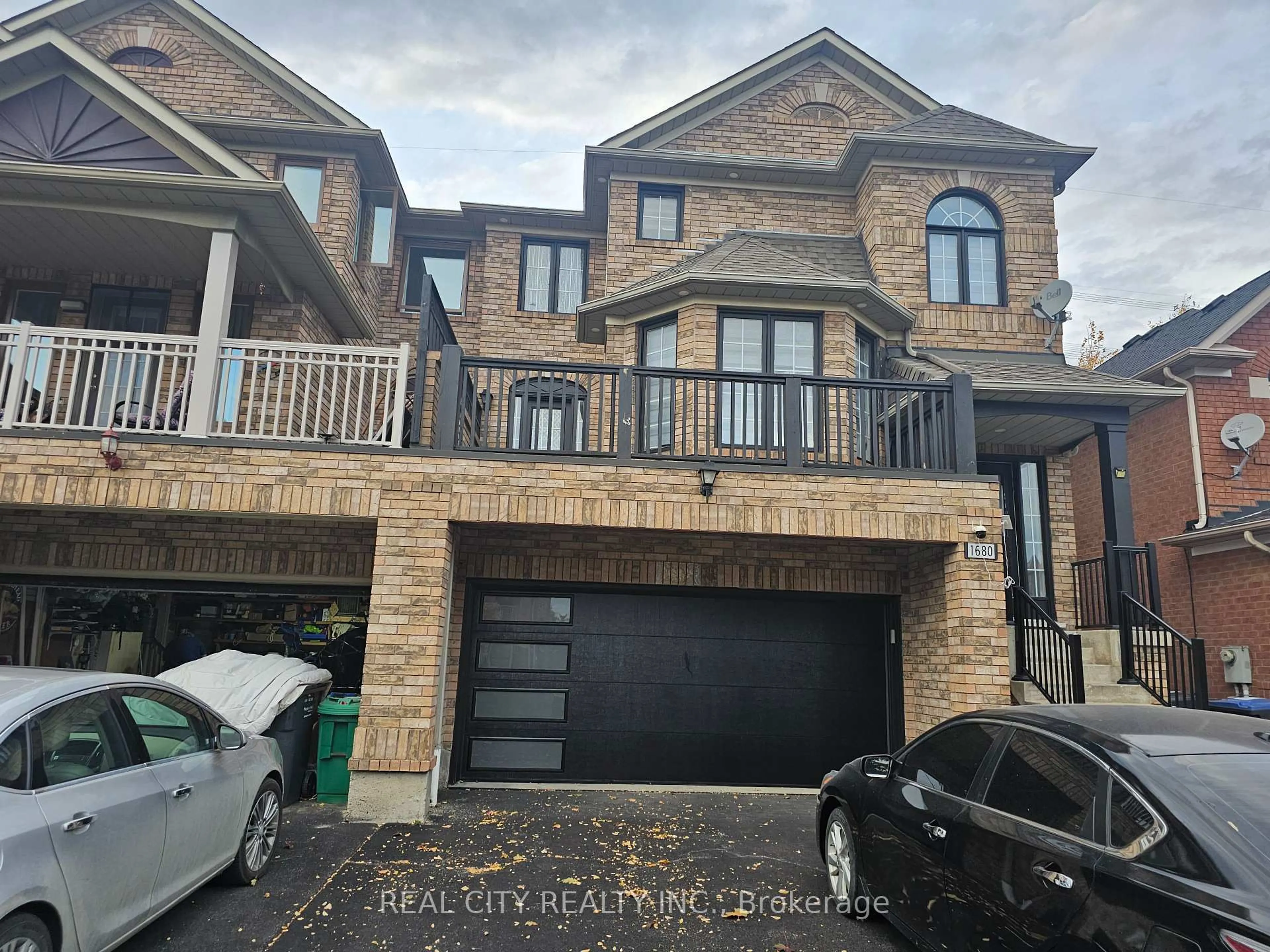 Home with brick exterior material, street for 1680 Samuelson Circ, Mississauga Ontario L5N 7Z7