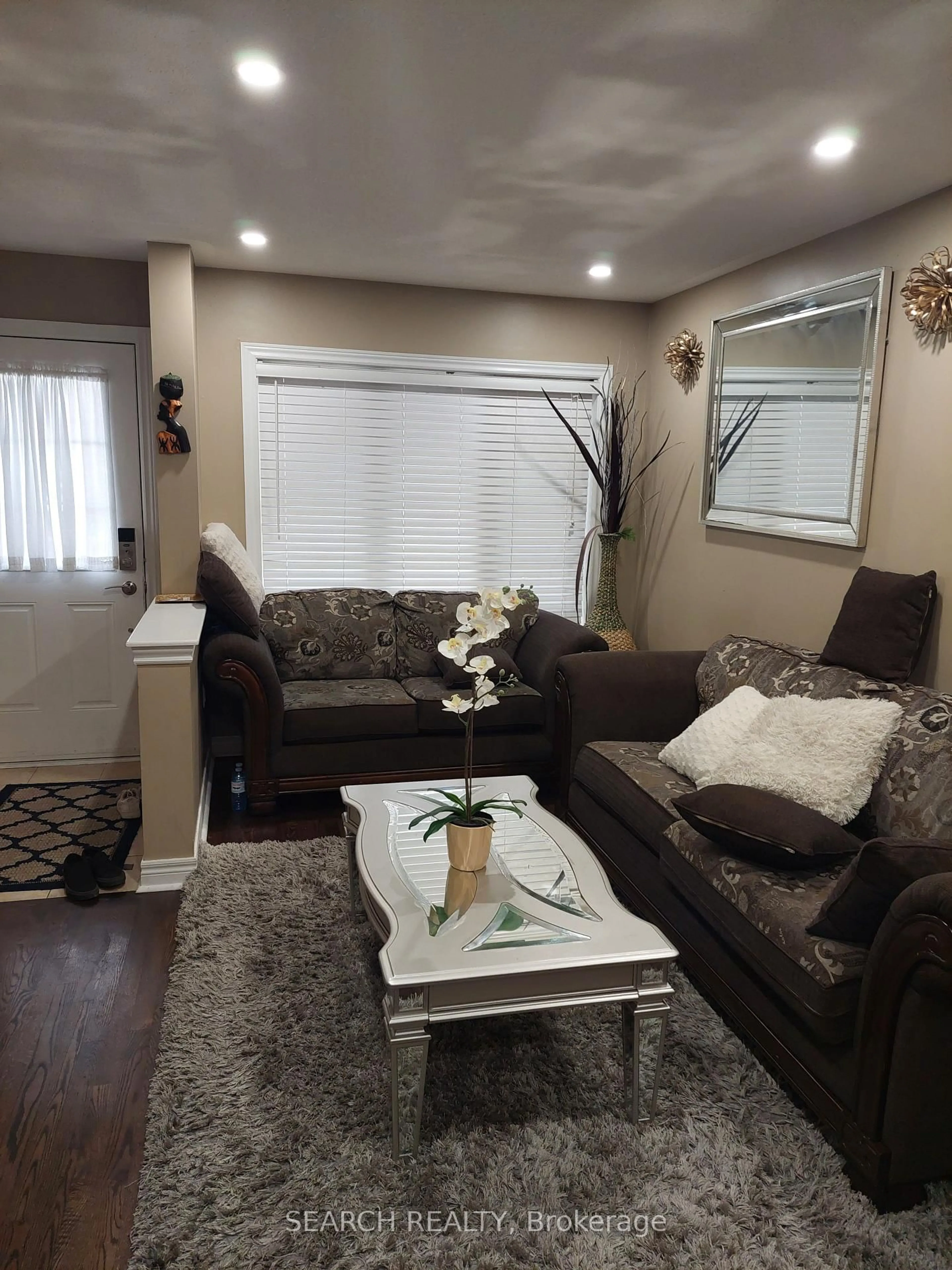 Living room with furniture, wood/laminate floor for 455 Scott Blvd, Milton Ontario L9T 0V1