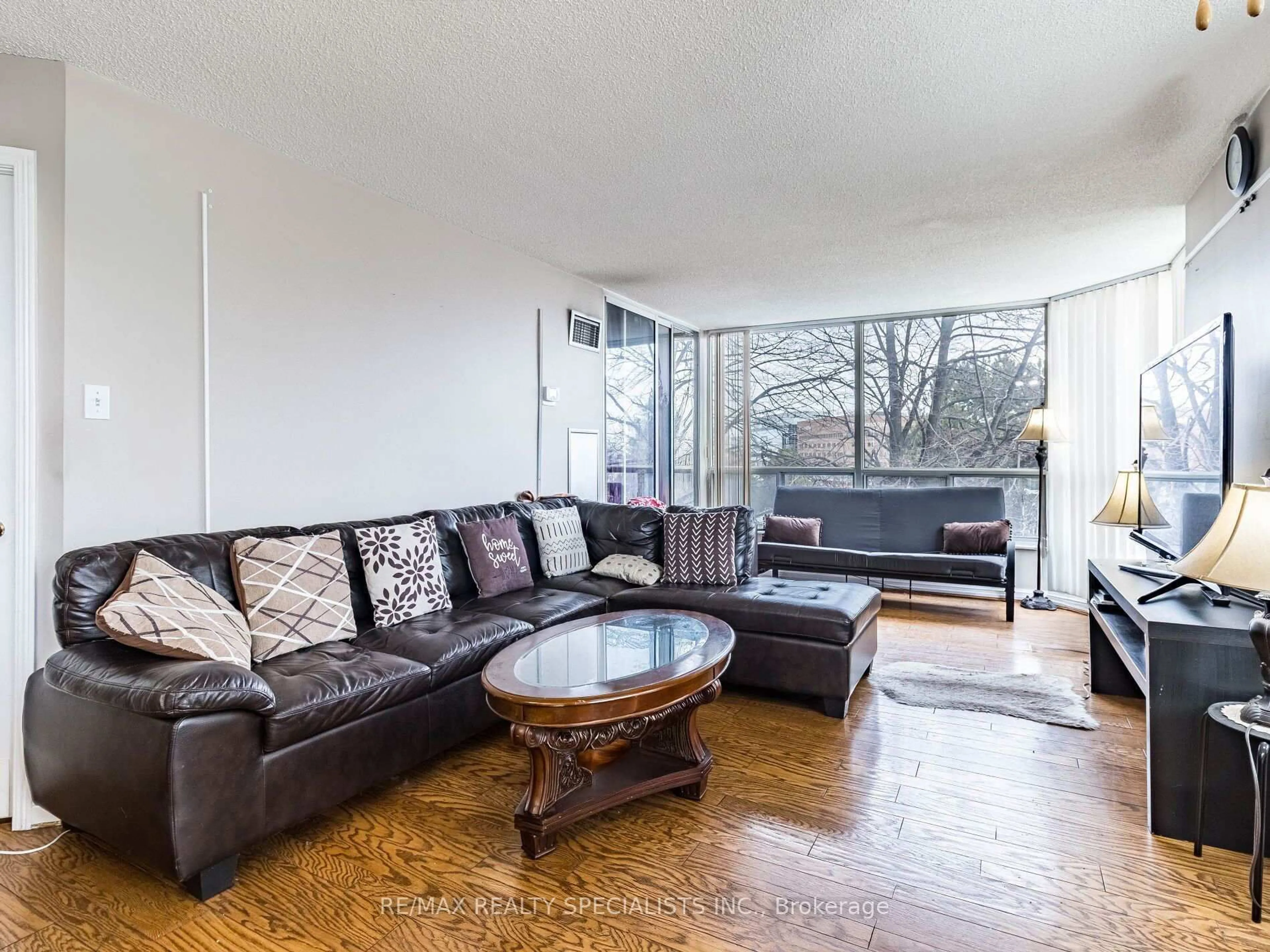 Living room with furniture, unknown for 22 Hanover Rd #210, Brampton Ontario L6S 5K7