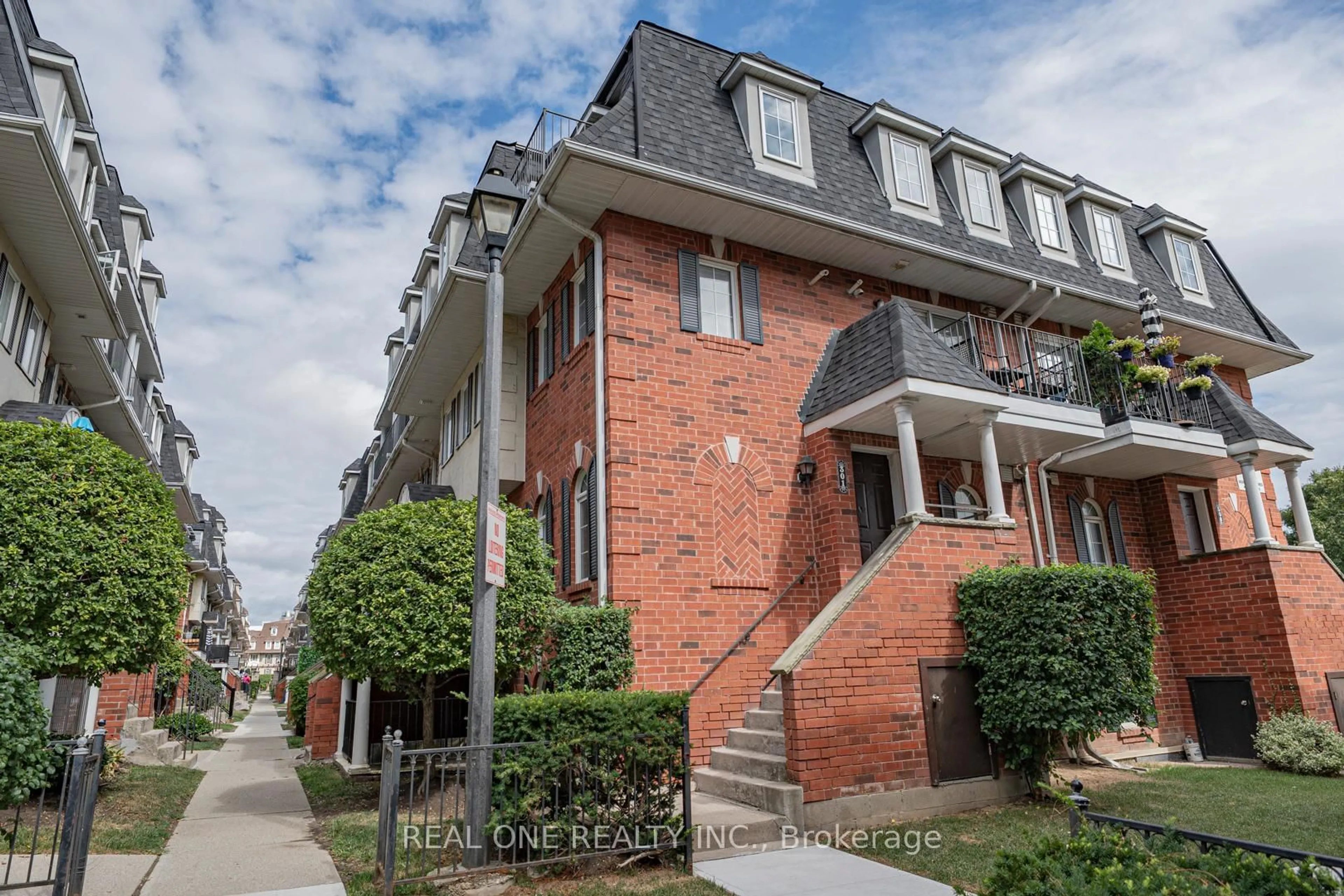 Home with brick exterior material, street for 66 Sidney Belsey Cres #301, Toronto Ontario M6M 5J4