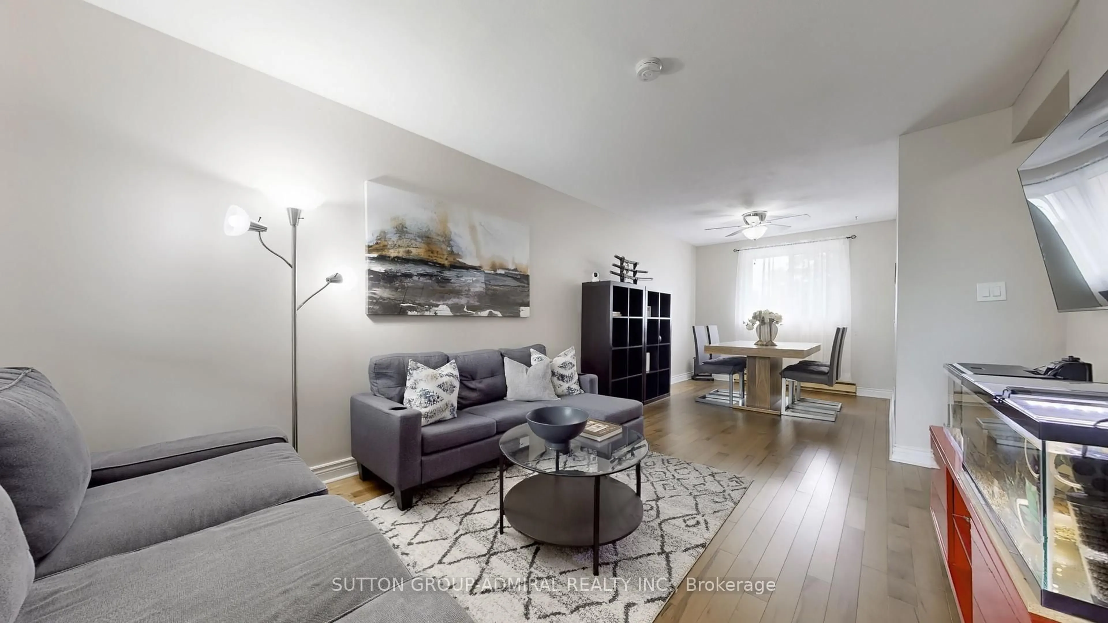 Living room with furniture, wood/laminate floor for 22 Tandridge Cres #812, Toronto Ontario M9W 2P2