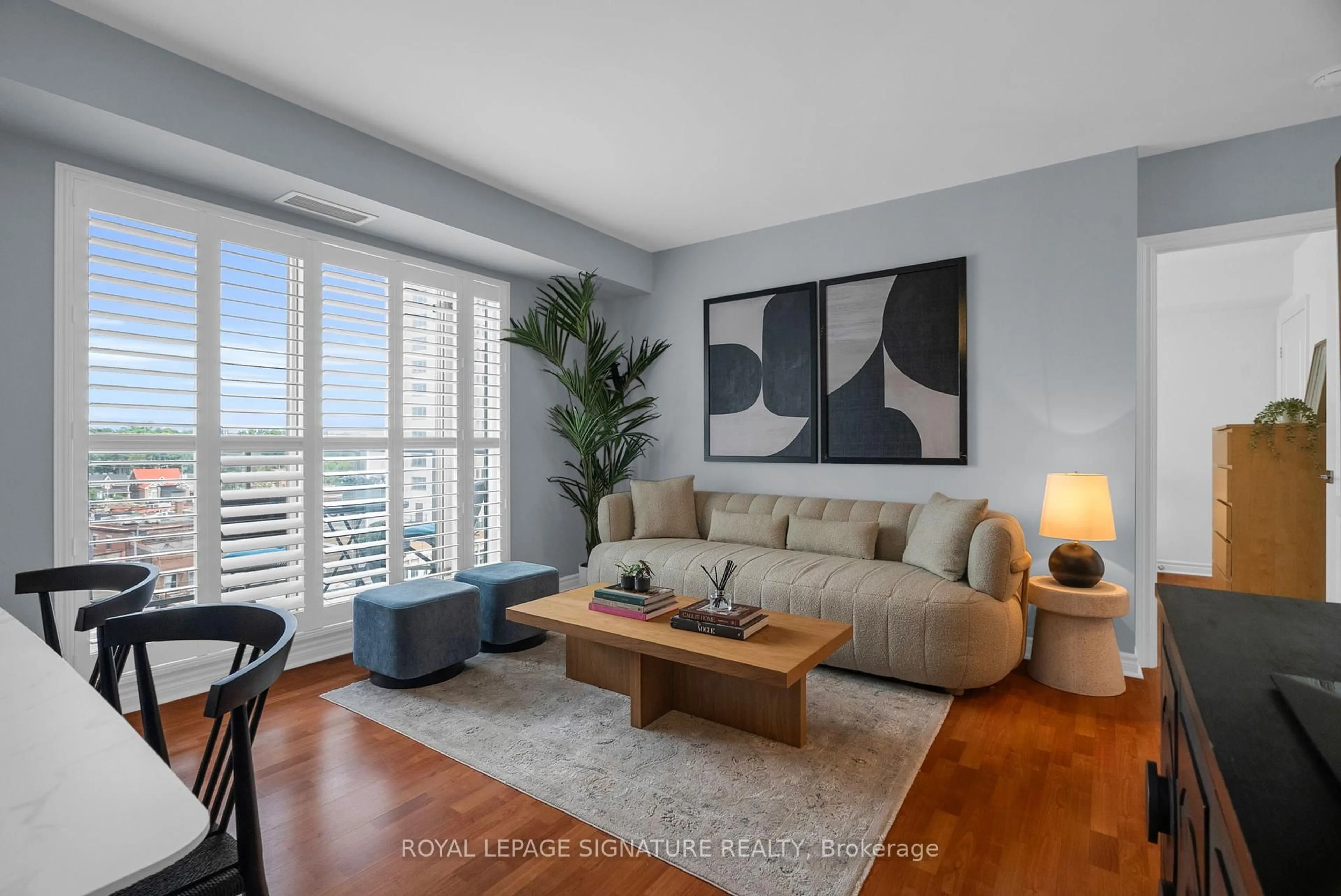 Living room with furniture, wood/laminate floor for 2088 Lawrence Ave #814, Toronto Ontario M9N 3Z9