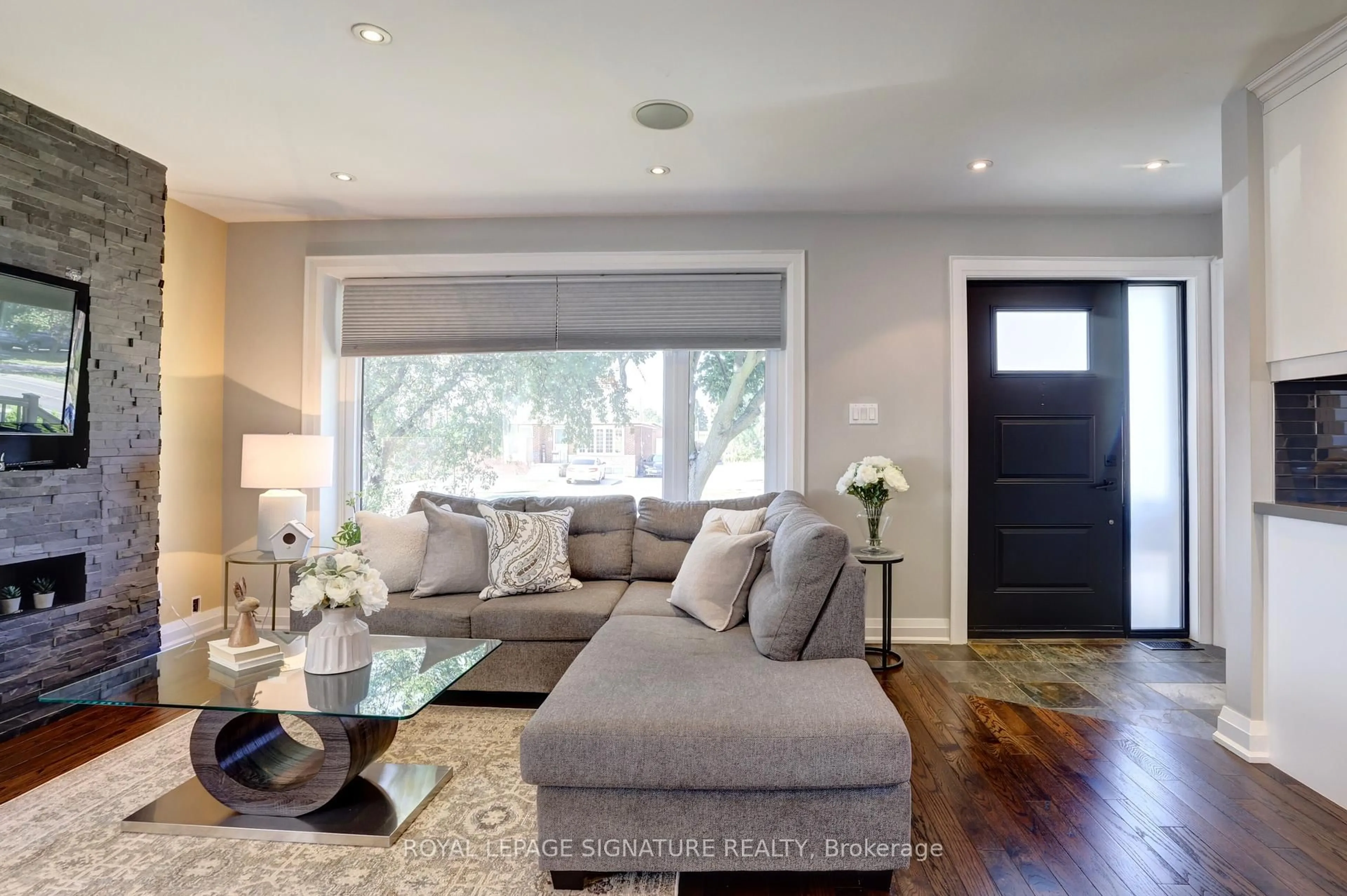 Living room with furniture, wood/laminate floor for 21 Harper Rd, Brampton Ontario L6W 2W3