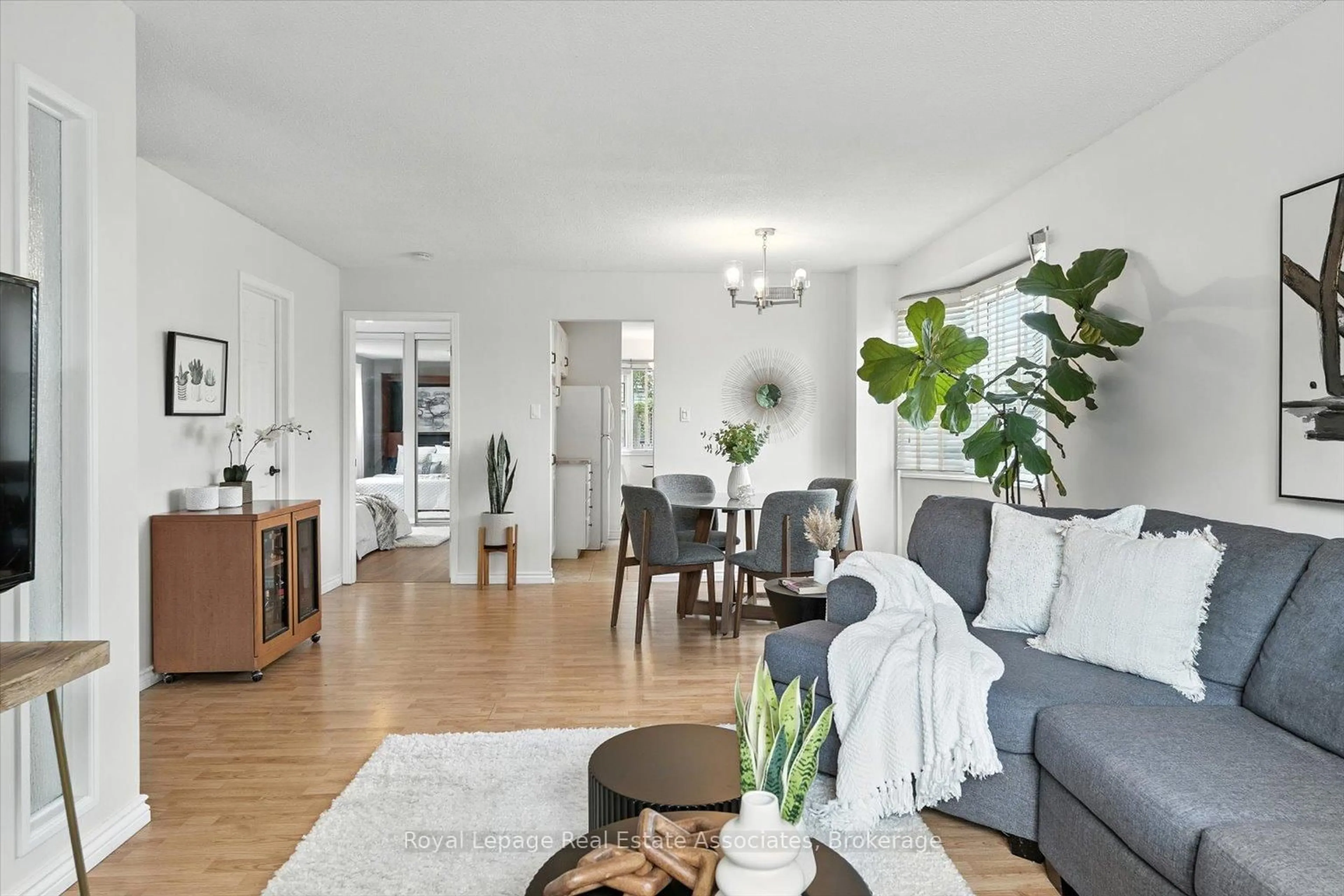 Living room with furniture, wood/laminate floor for 45 Quarry Dr, Orangeville Ontario L9W 3S6