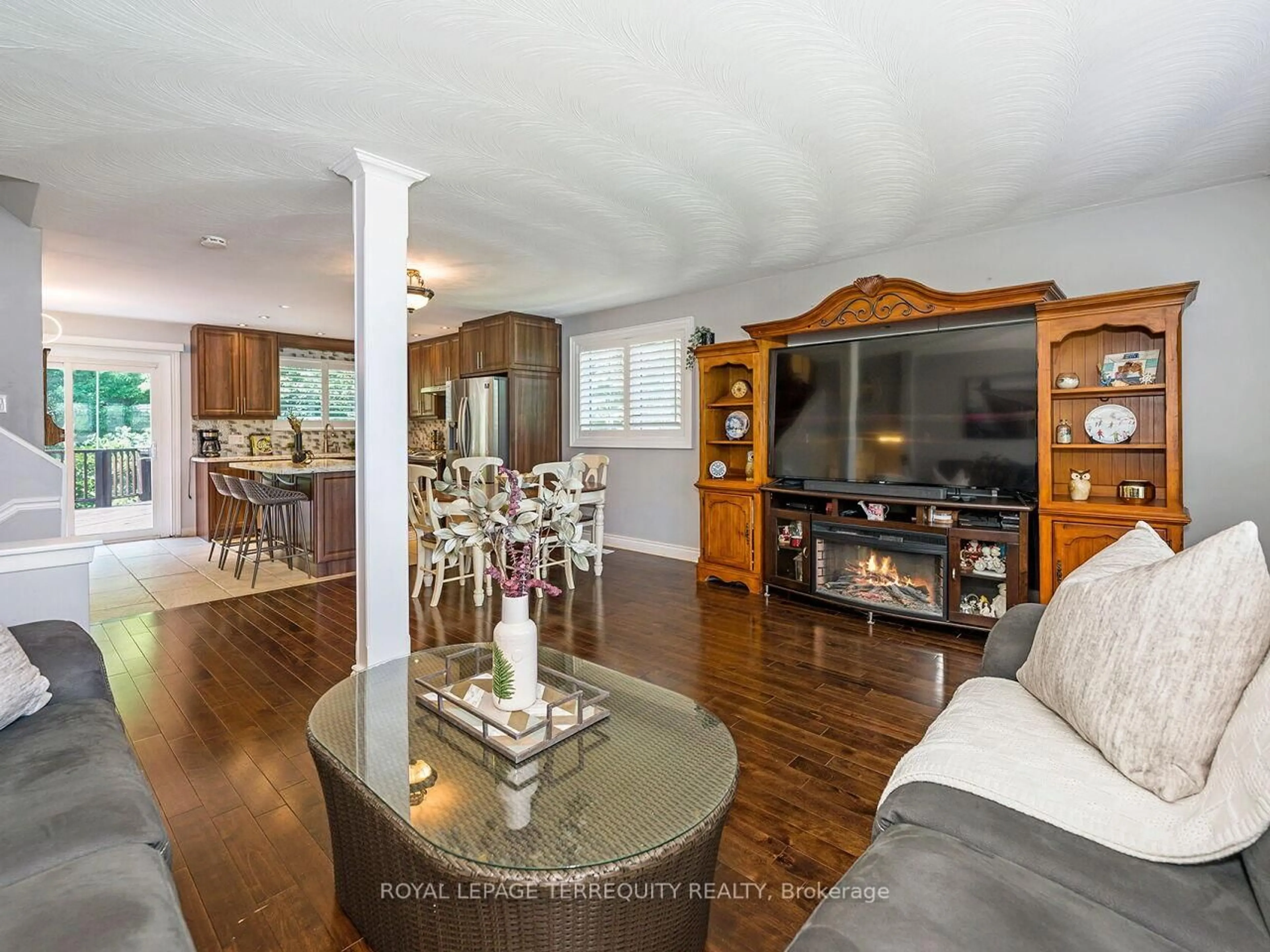 Living room with furniture, wood/laminate floor for 21 Pylon Pl, Toronto Ontario M9W 2P3