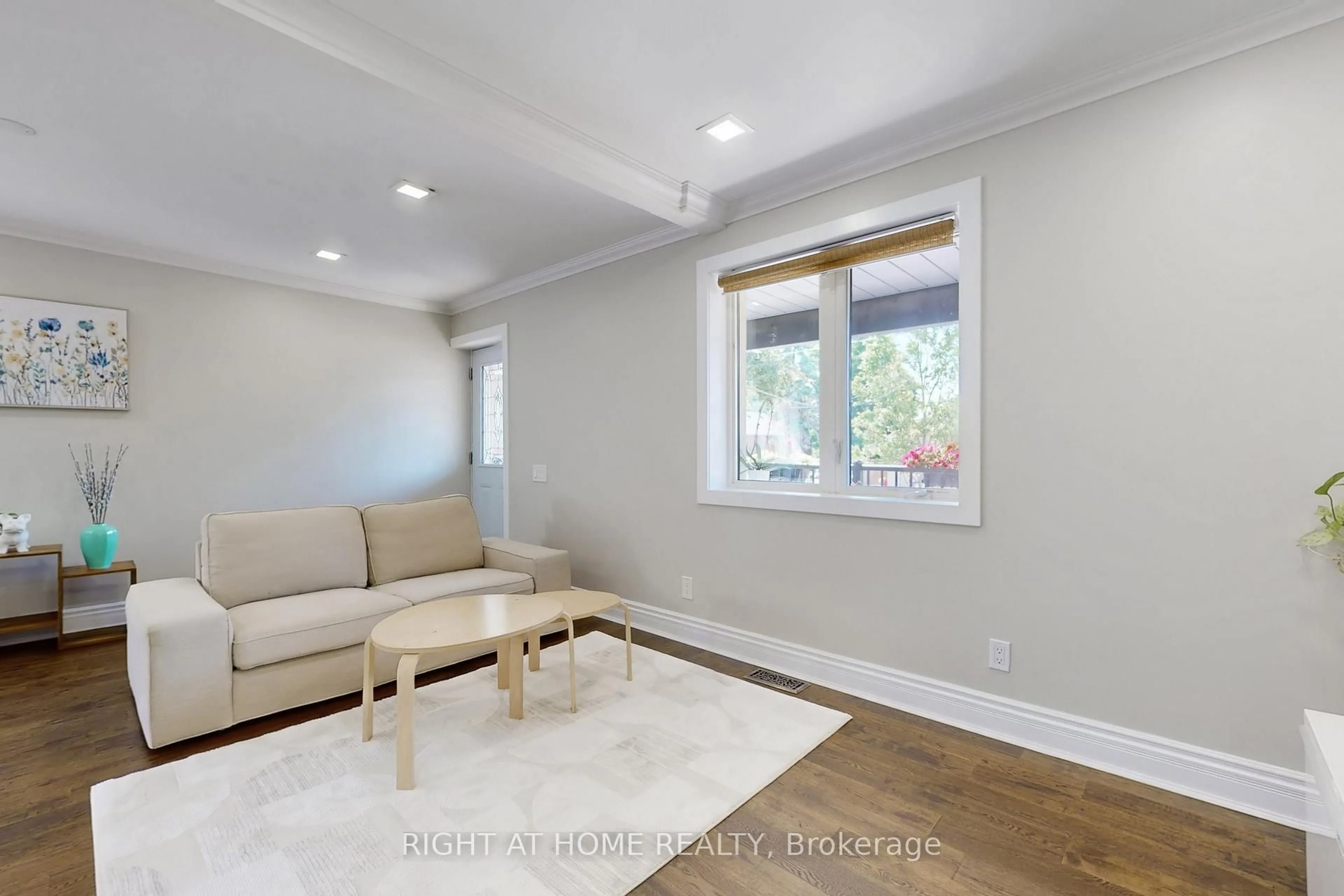 Living room with furniture, wood/laminate floor for 36 Juliet Cres, Toronto Ontario M6M 1N4