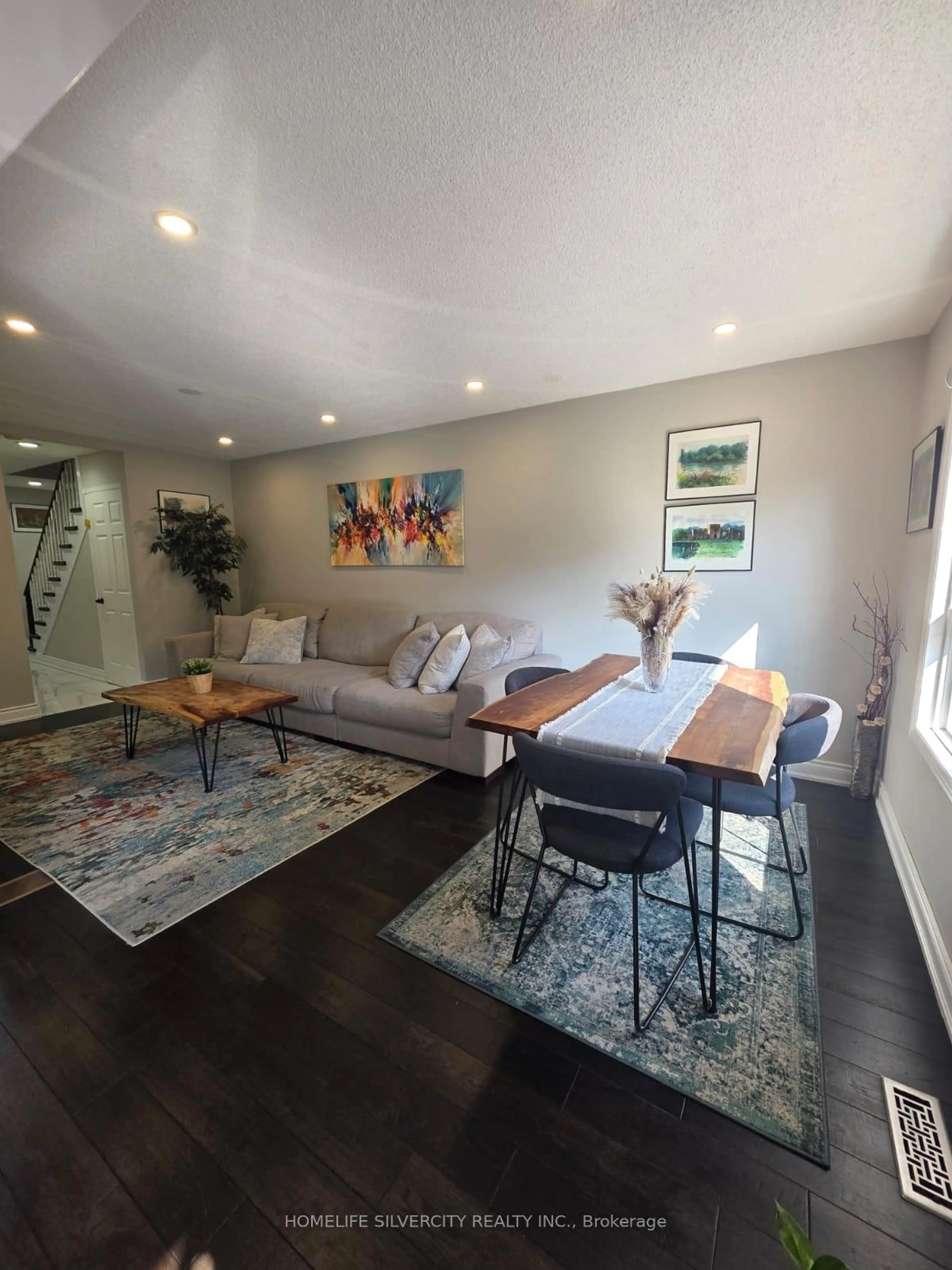 Living room with furniture, wood/laminate floor for 4800 Rosebush Rd, Mississauga Ontario L5M 5N1