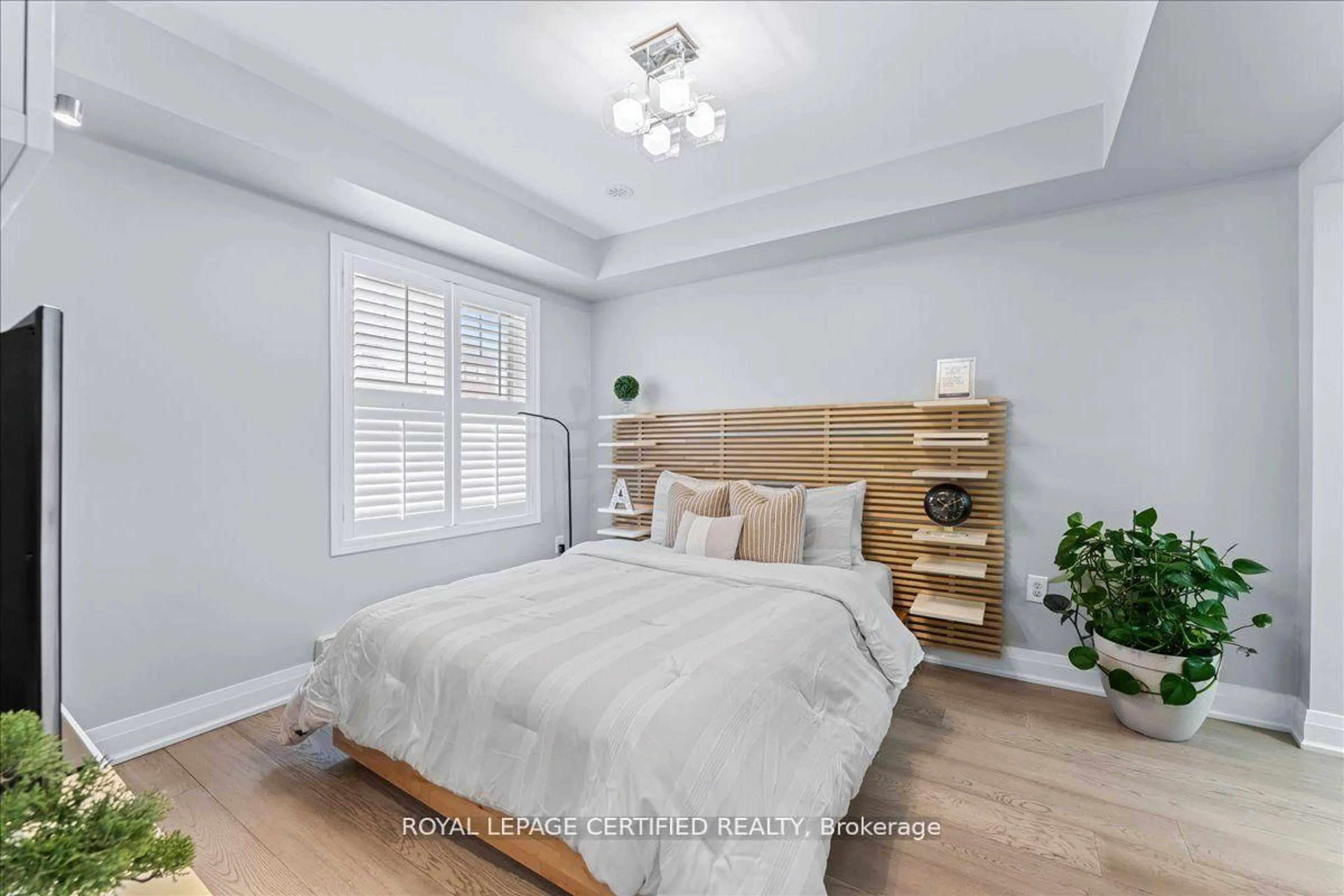 Bedroom with bed, wood/laminate floor for 26 Ganton Hts, Brampton Ontario L7A 0S4