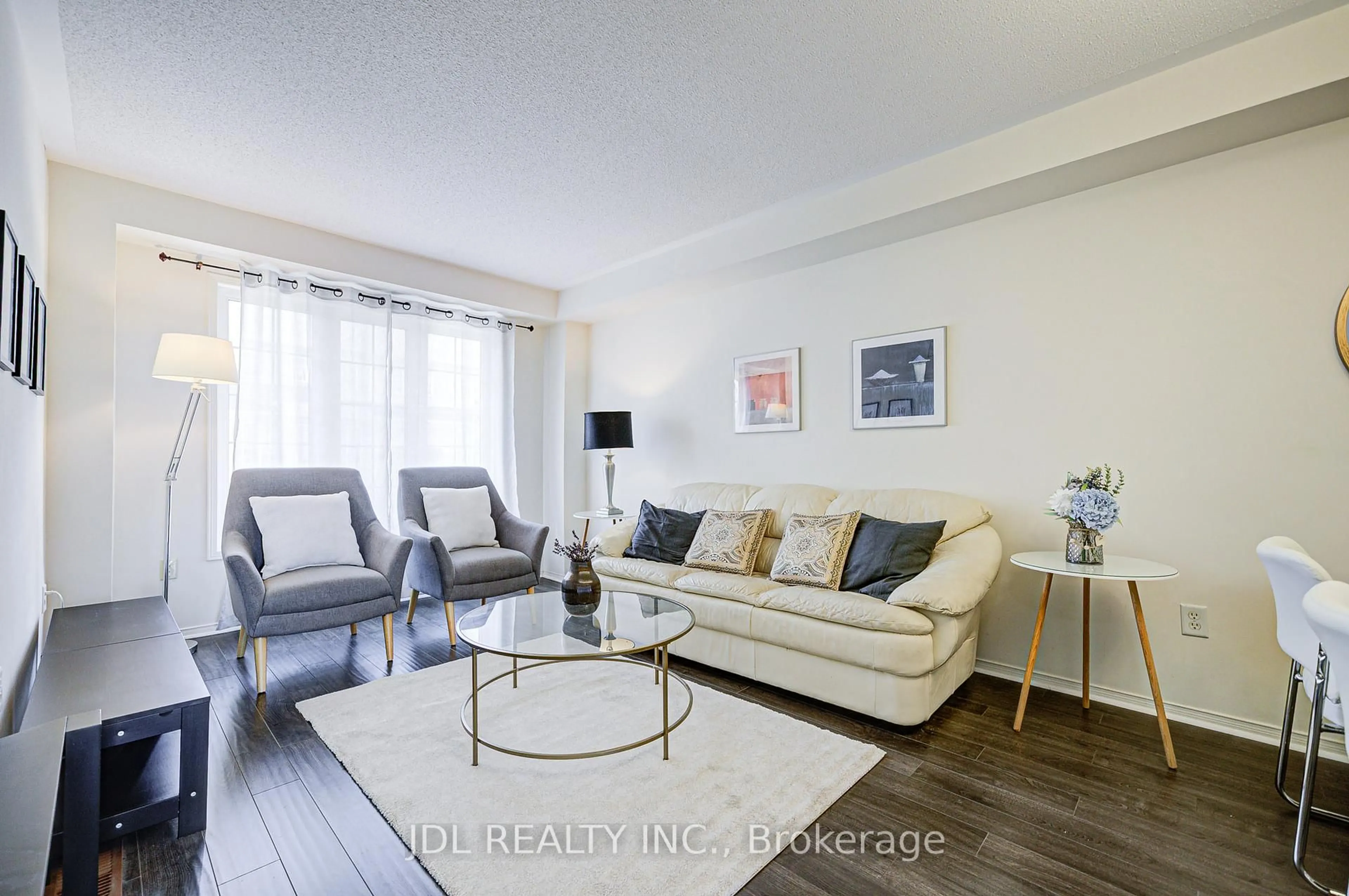 Living room with furniture, wood/laminate floor for 4950 Albina Way #81, Mississauga Ontario L4Z 4J5