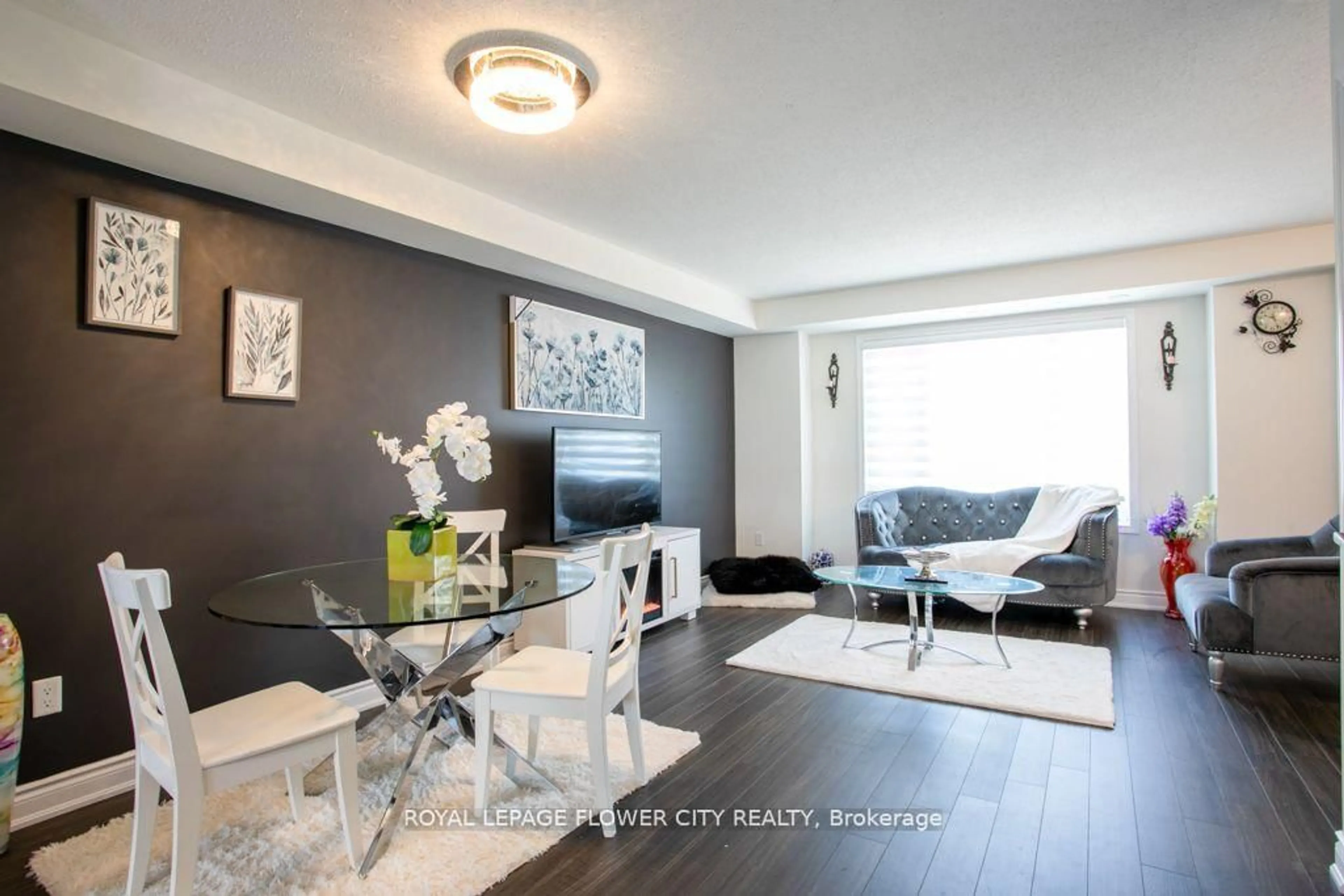 Living room with furniture, wood/laminate floor for 1 Beckenrose Crt #30, Brampton Ontario L6Y 6G2