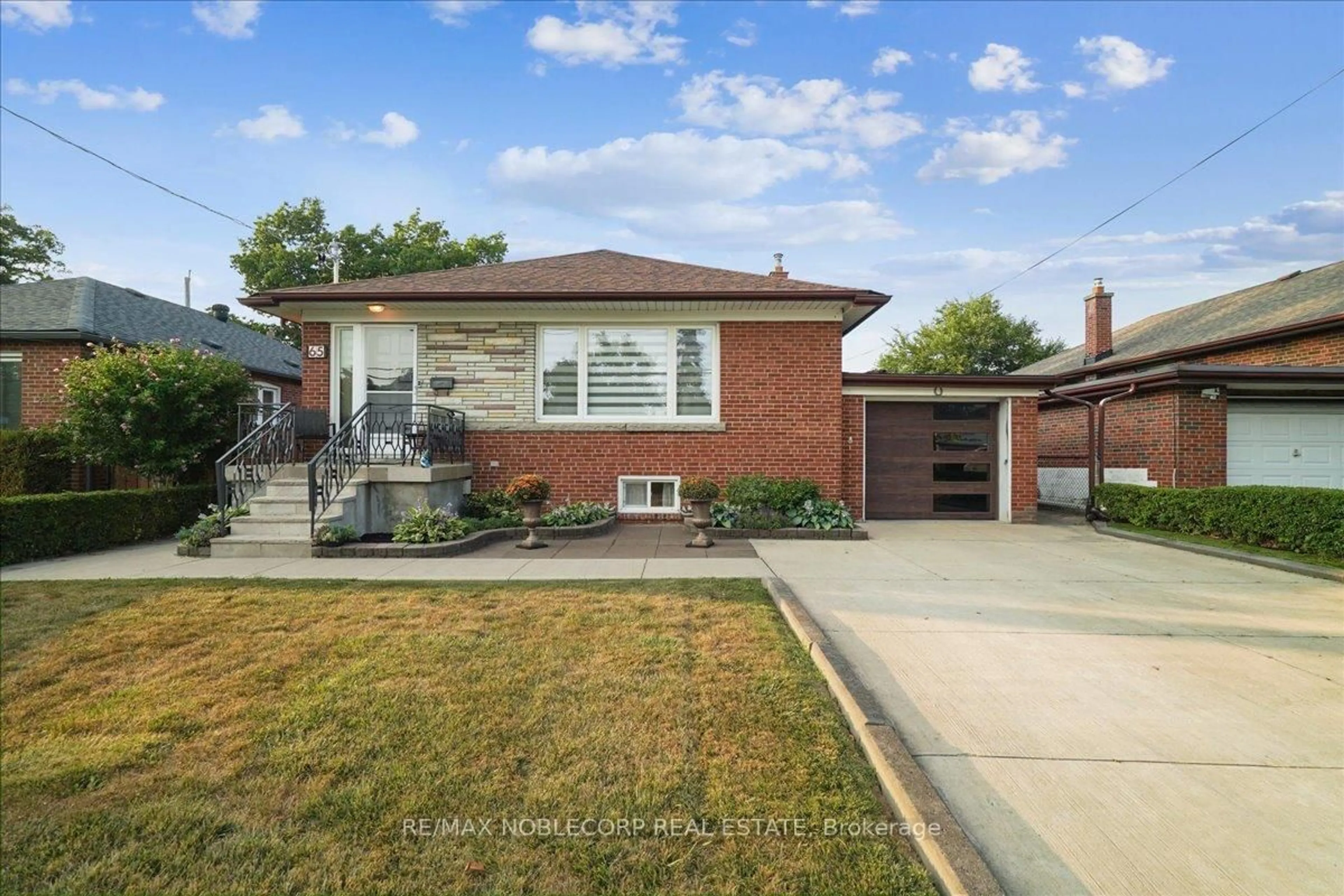 Home with brick exterior material, street for 65 Exbury Rd, Toronto Ontario M3M 1P9