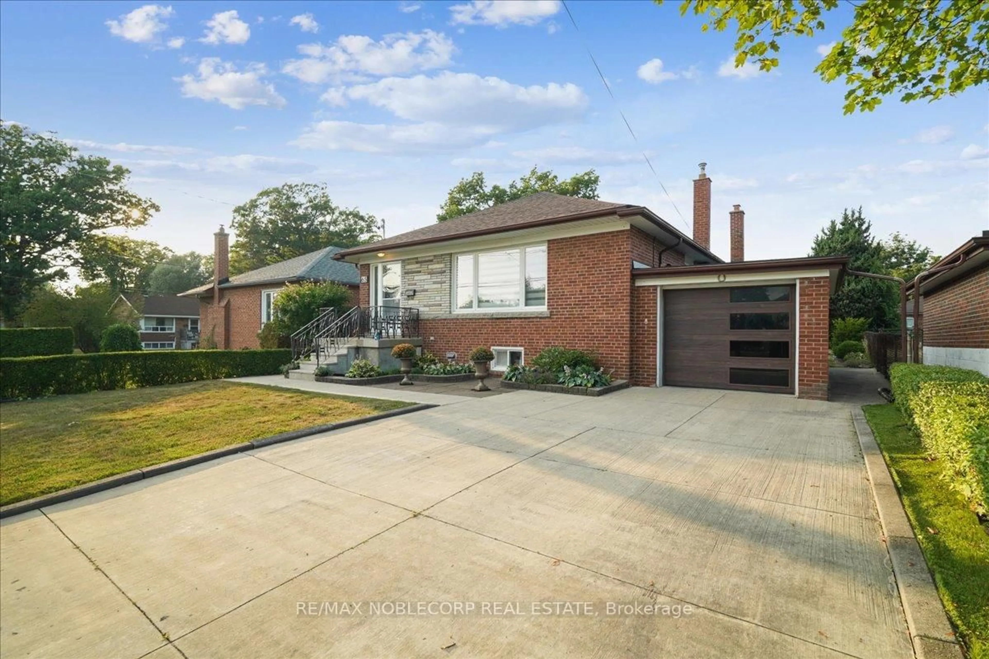 Home with brick exterior material, street for 65 Exbury Rd, Toronto Ontario M3M 1P9