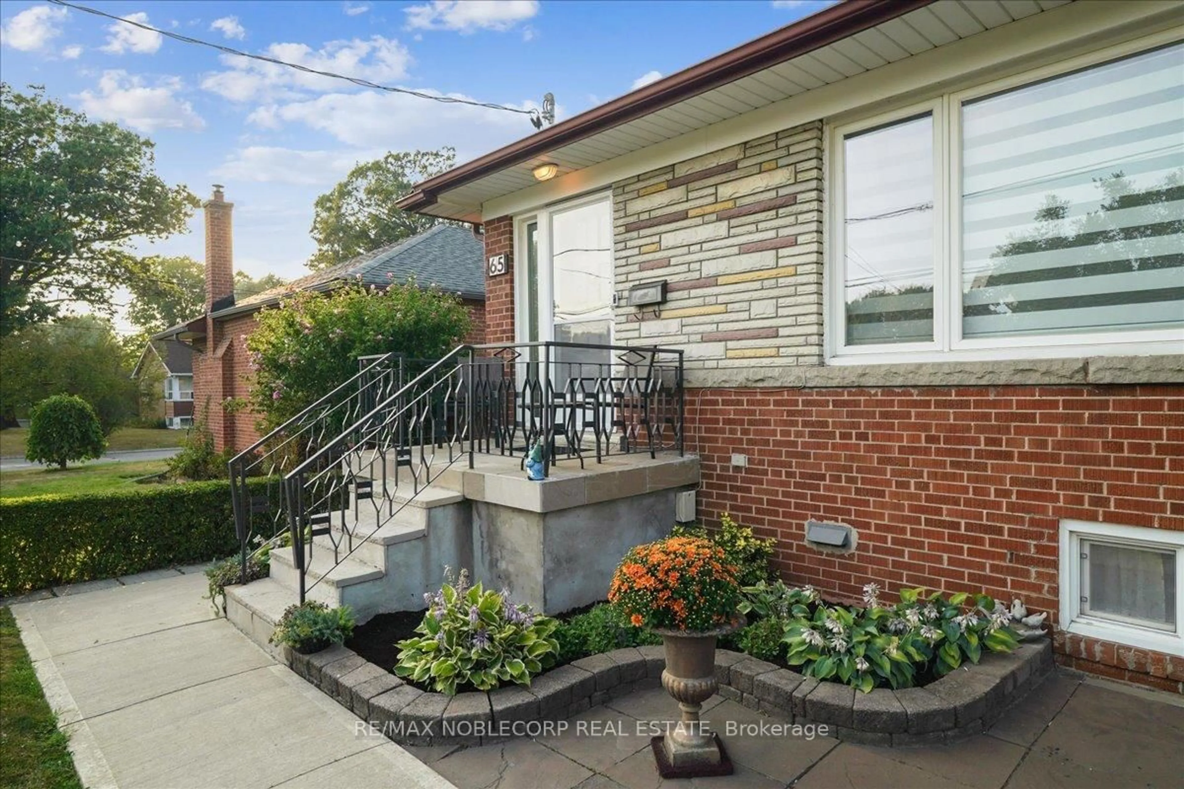 Home with brick exterior material, street for 65 Exbury Rd, Toronto Ontario M3M 1P9