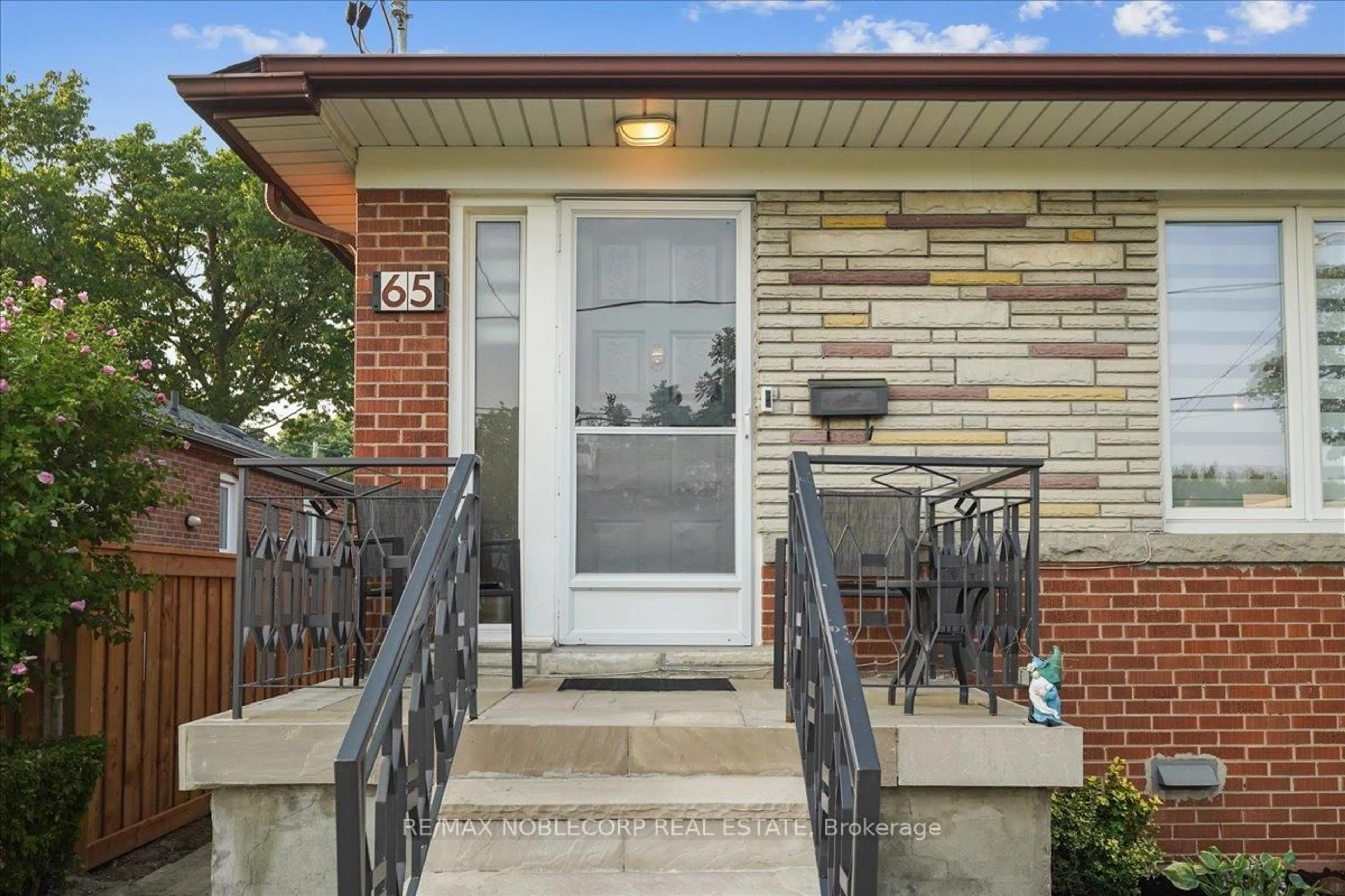 Home with brick exterior material, street for 65 Exbury Rd, Toronto Ontario M3M 1P9
