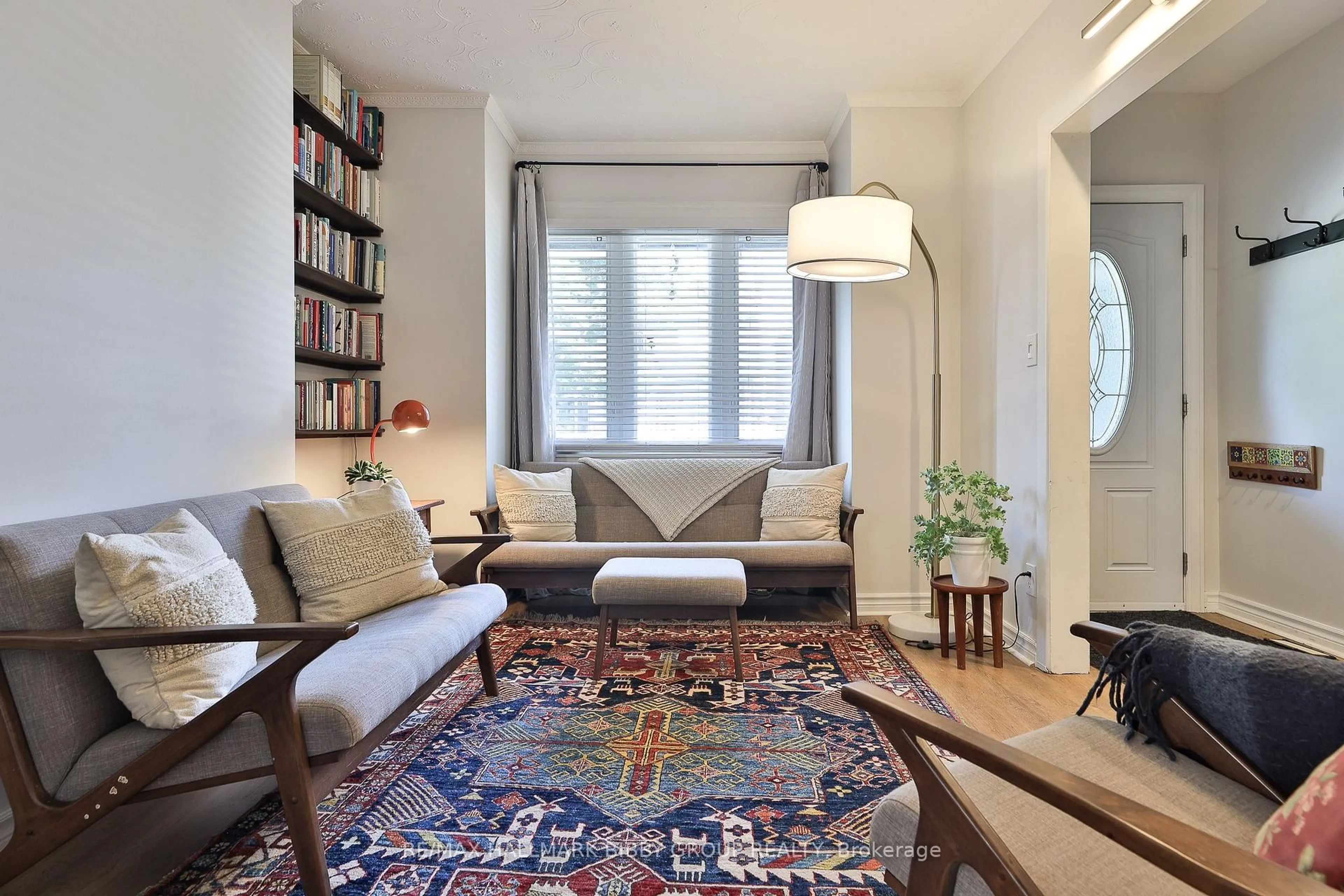 Living room with furniture, carpet floor for 33 Exeter St, Toronto Ontario M6N 1G3