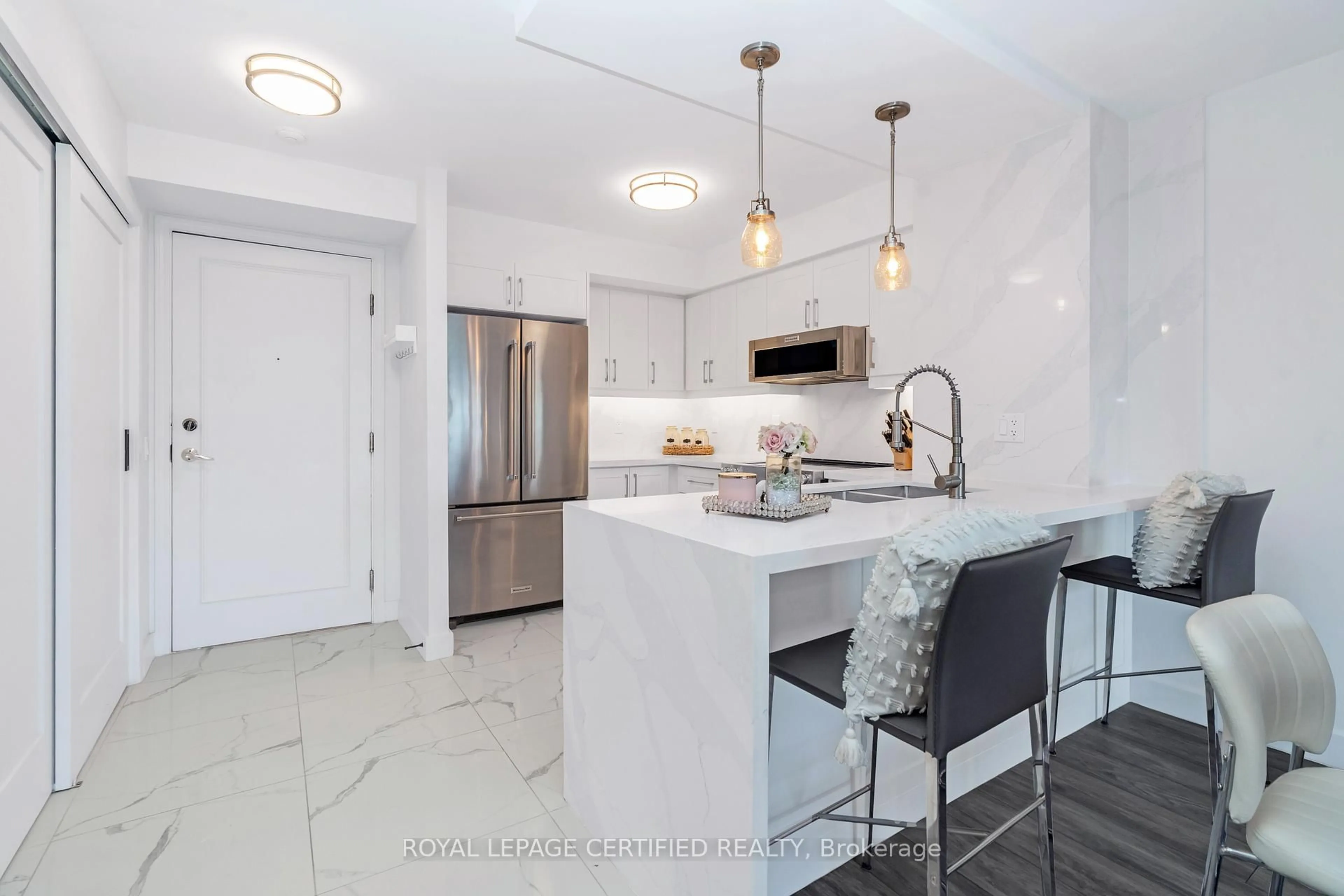 Open concept kitchen, ceramic/tile floor for 25 Kingsbridge Garden Circ #1527, Mississauga Ontario L5R 4B1