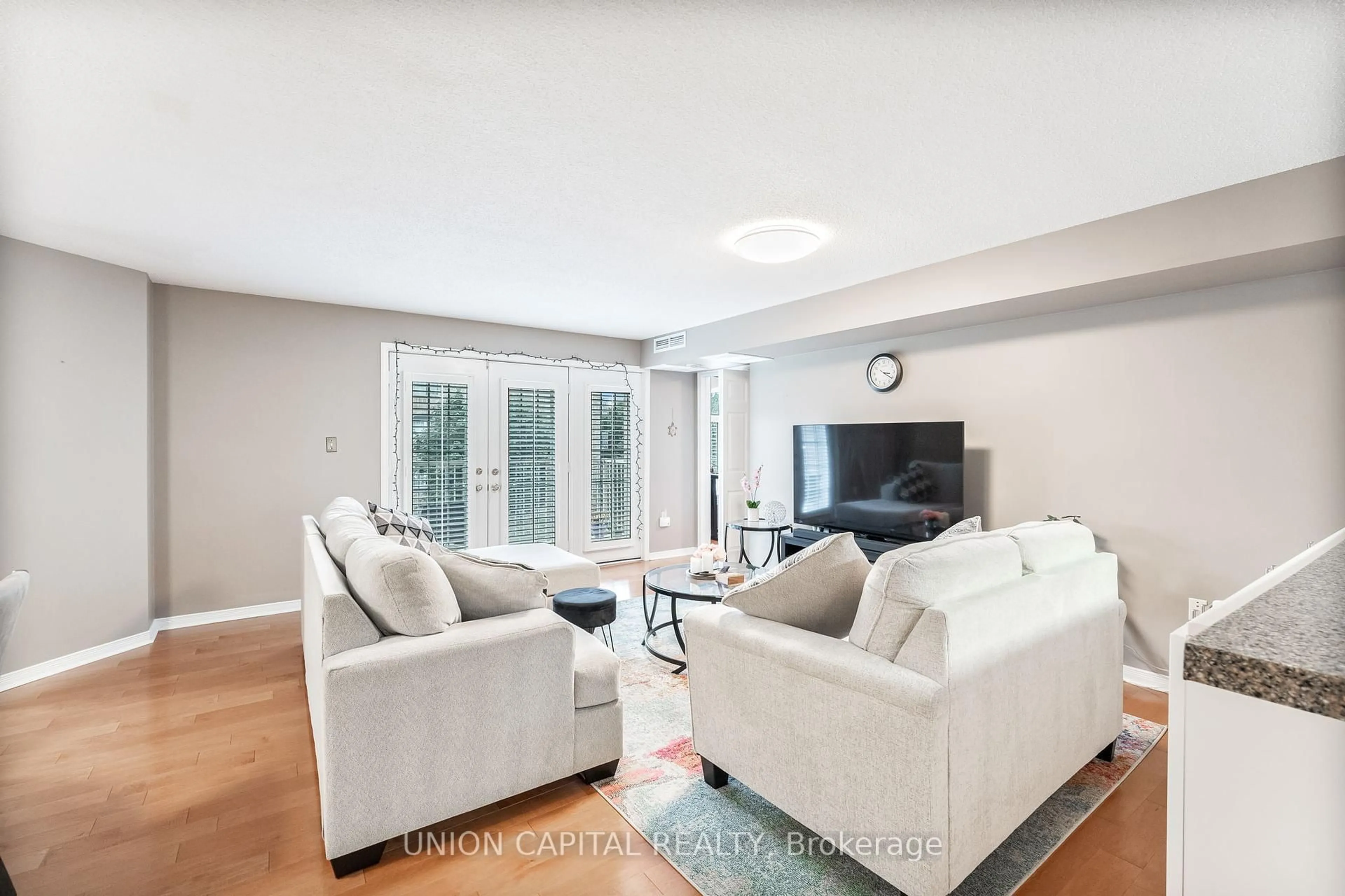 Living room with furniture, unknown for 216 Plains Rd #F304, Burlington Ontario L7T 4K8