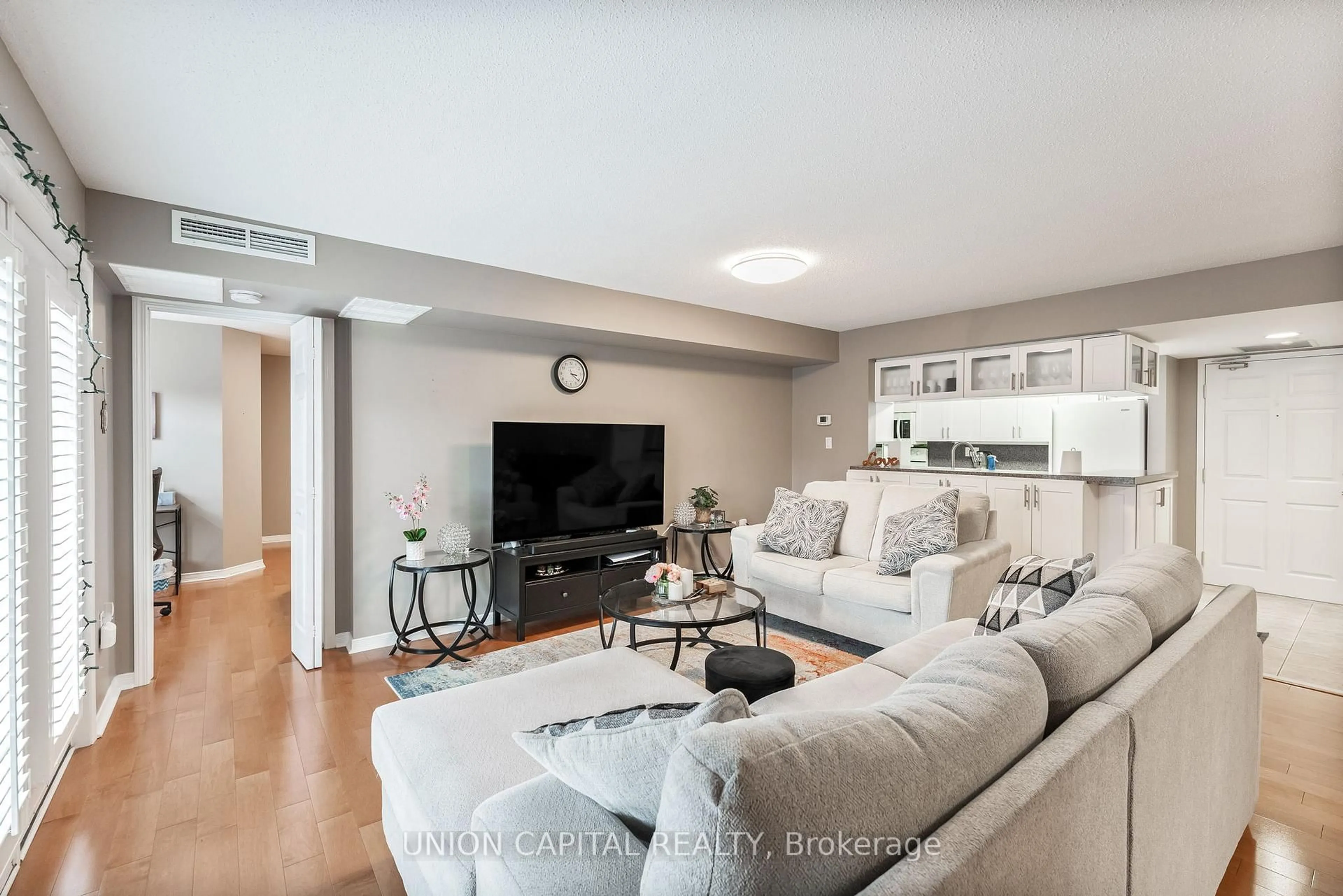 Living room with furniture, unknown for 216 Plains Rd #F304, Burlington Ontario L7T 4K8