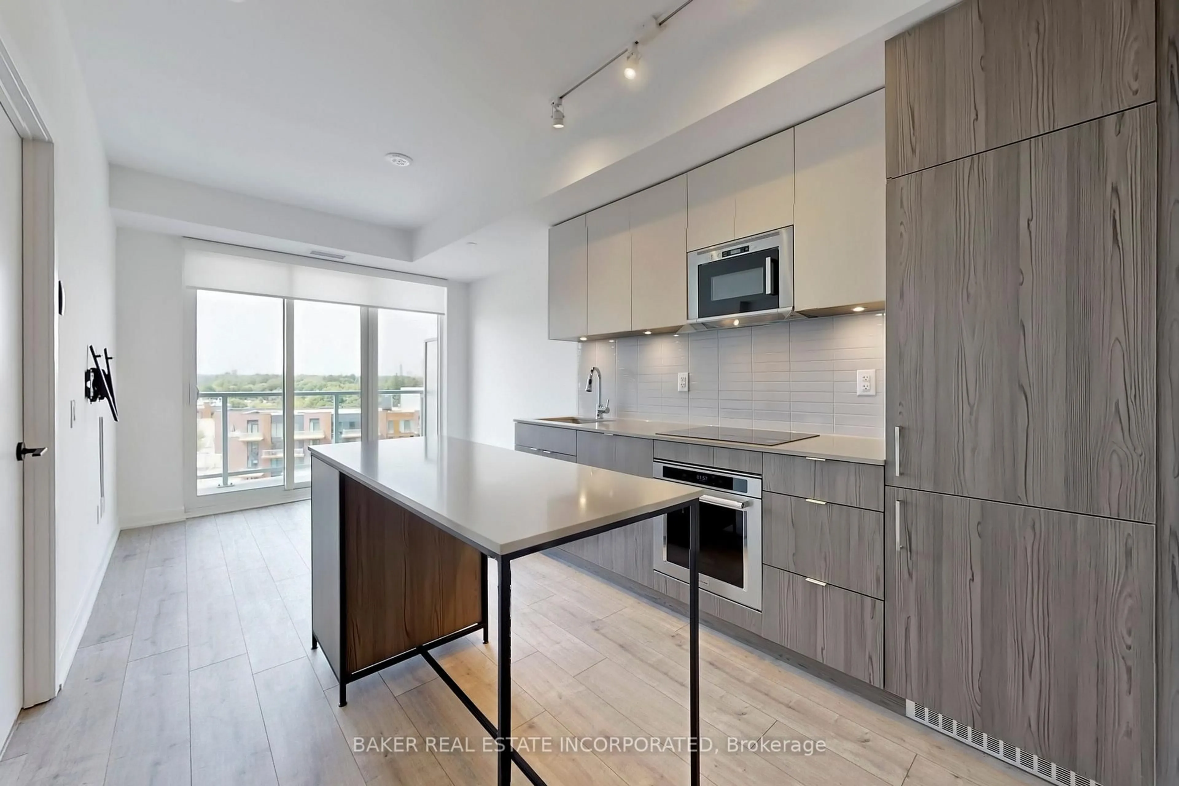 Open concept kitchen, wood/laminate floor for 220 Missinnihe Way #815, Mississauga Ontario L5H 0A9