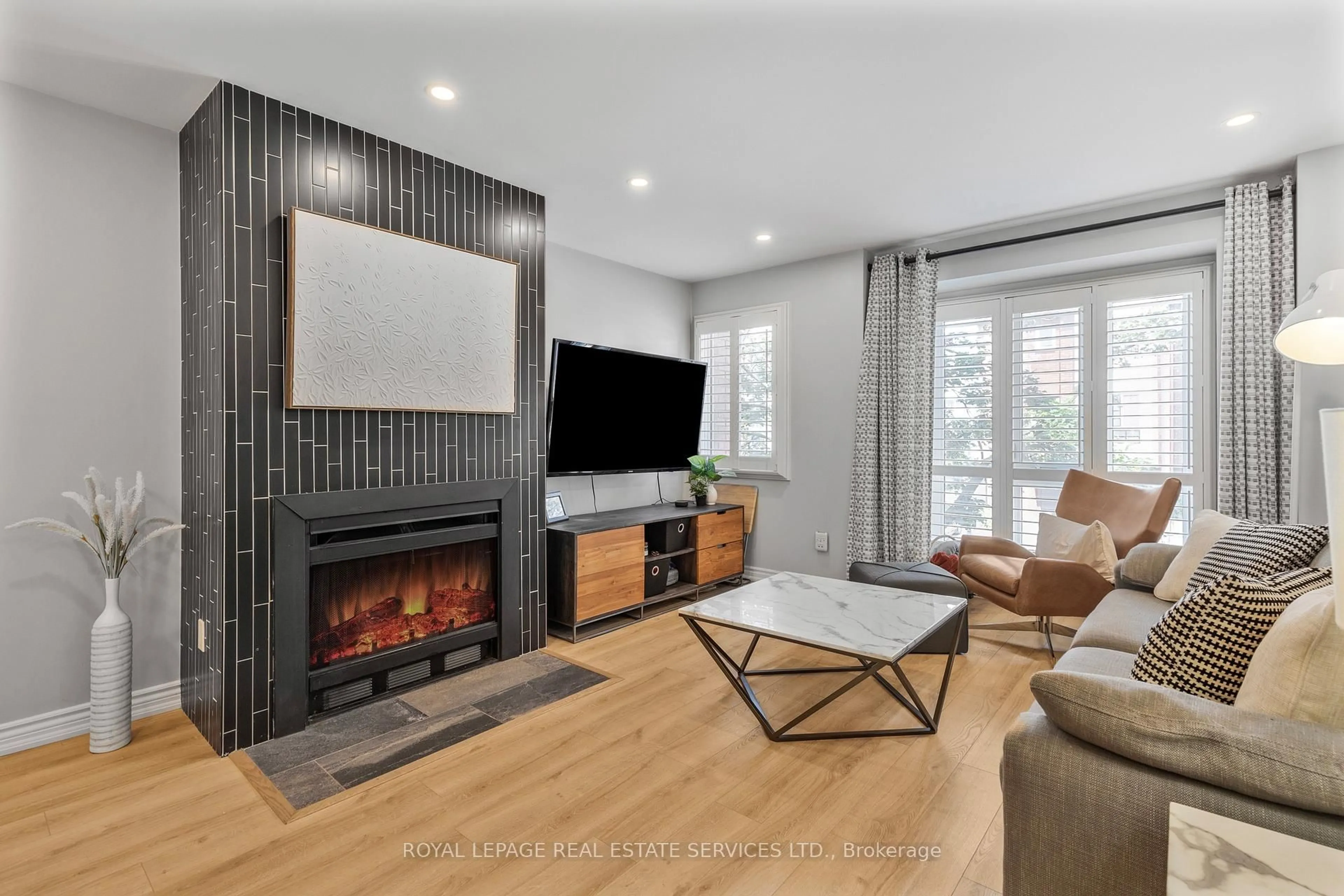 Living room with furniture, ceramic/tile floor for 895 Maple Ave #217, Burlington Ontario L7S 2H7
