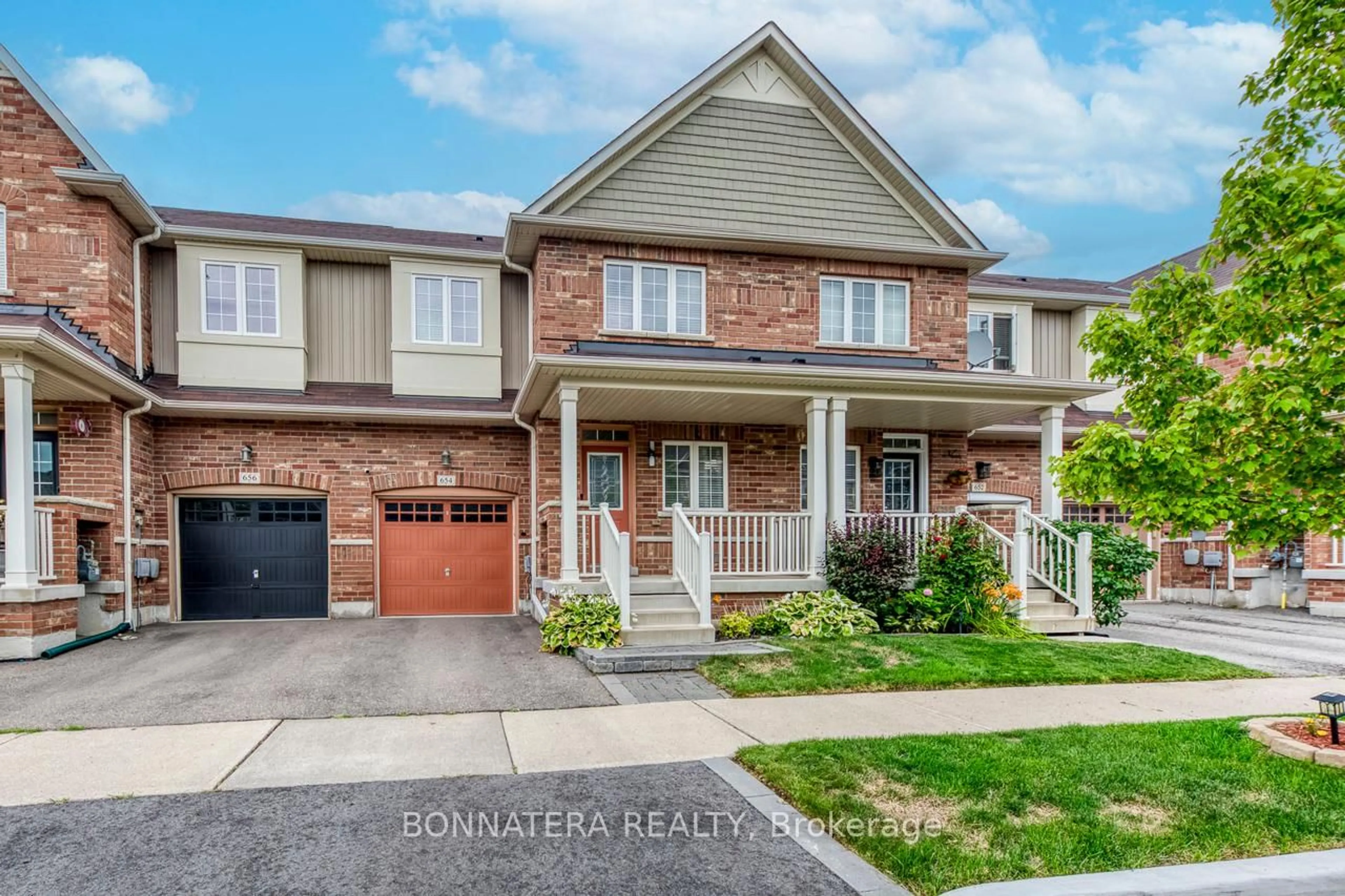 Home with brick exterior material, street for 654 Murray Meadows Pl, Milton Ontario L9T 8L9