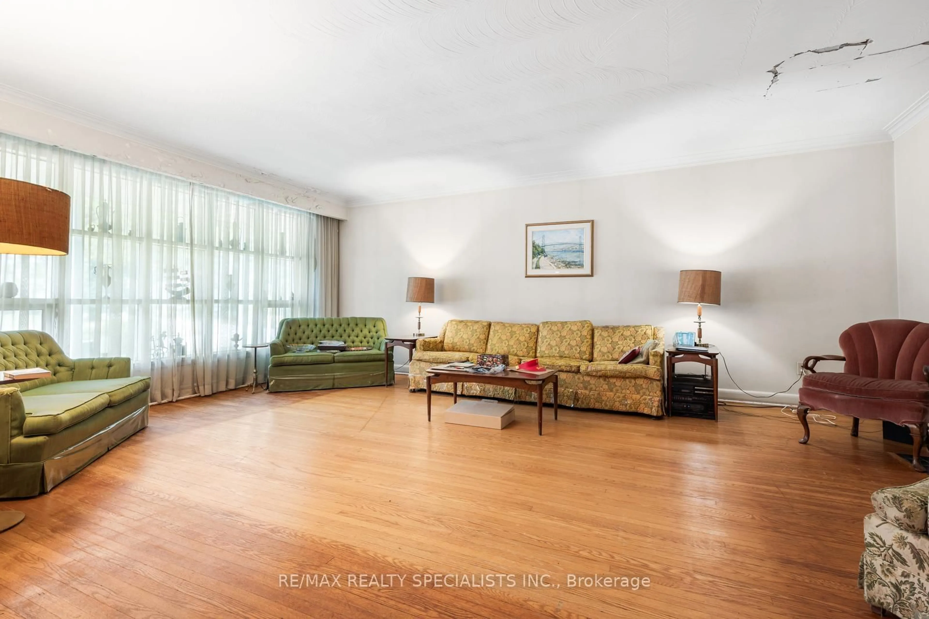 Living room with furniture, wood/laminate floor for 9 Prince George Dr, Toronto Ontario M9A 1X9