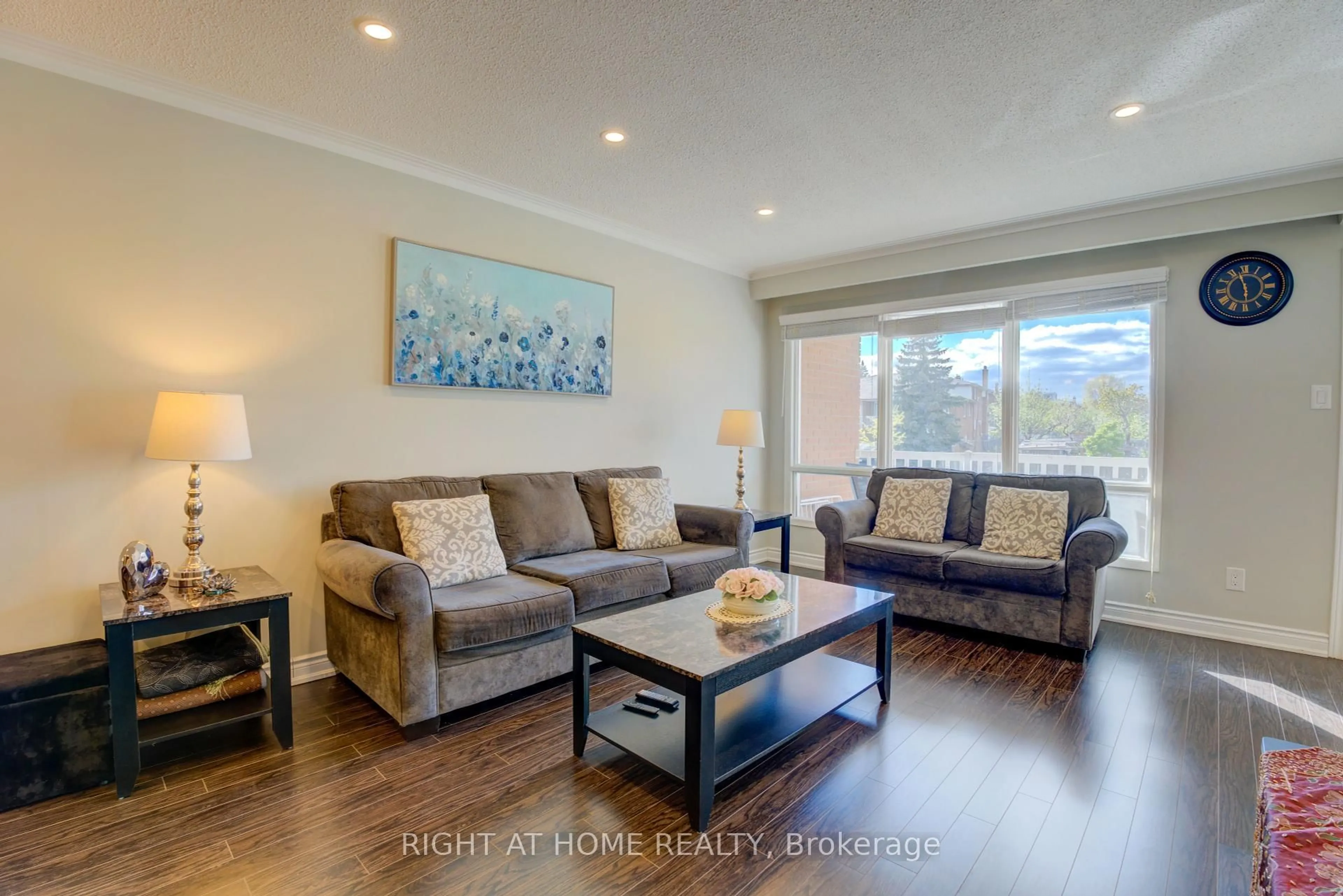 Living room with furniture, wood/laminate floor for 208 Meadows Blvd, Mississauga Ontario L4Z 1J9