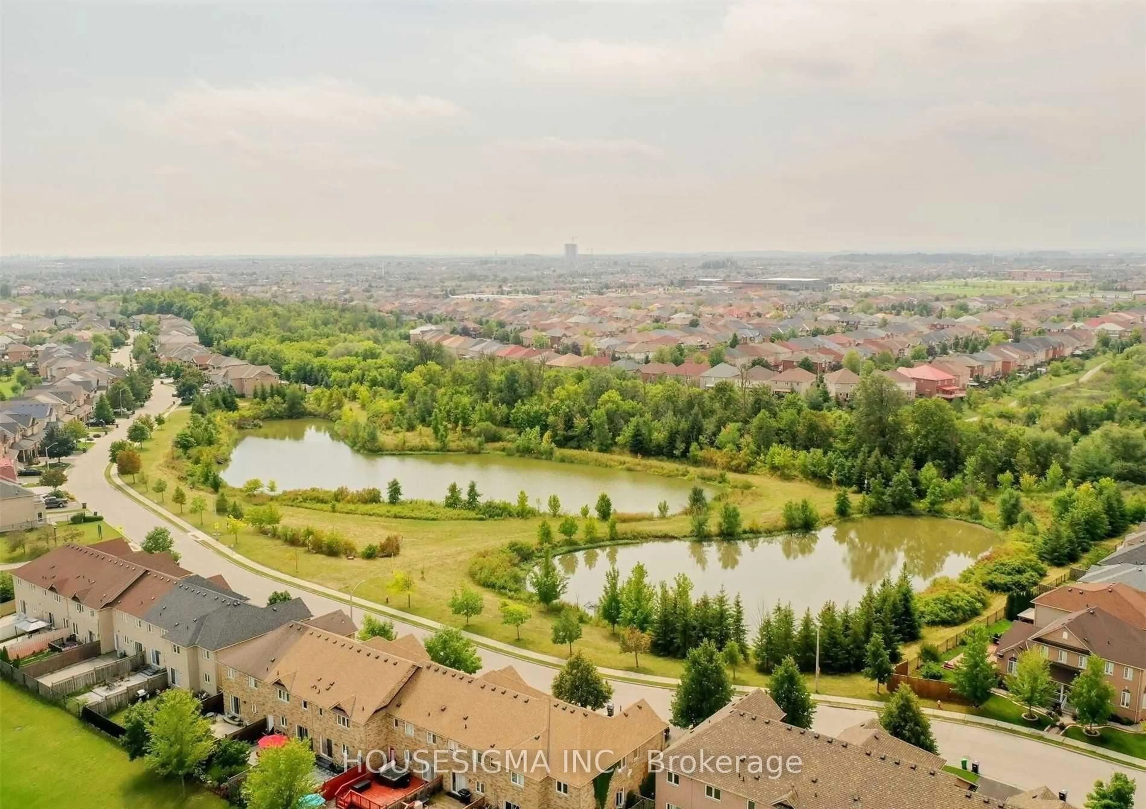 A pic from outside/outdoor area/front of a property/back of a property/a pic from drone, water/lake/river/ocean view for 77 Beavervalley Dr, Brampton Ontario L7A 3R3