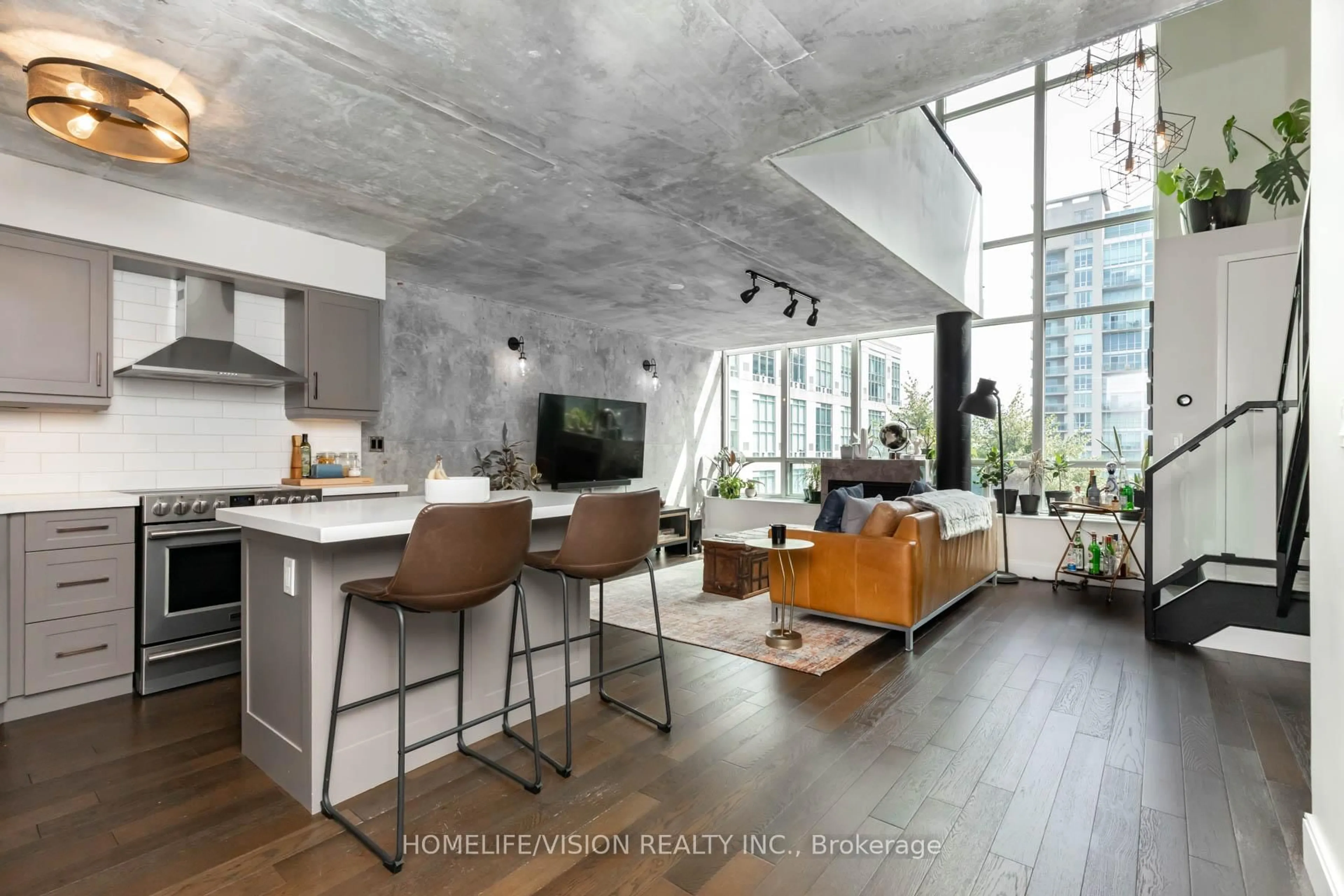 Open concept kitchen, cement floor for 250 Manitoba St #704, Toronto Ontario M8Y 4G8