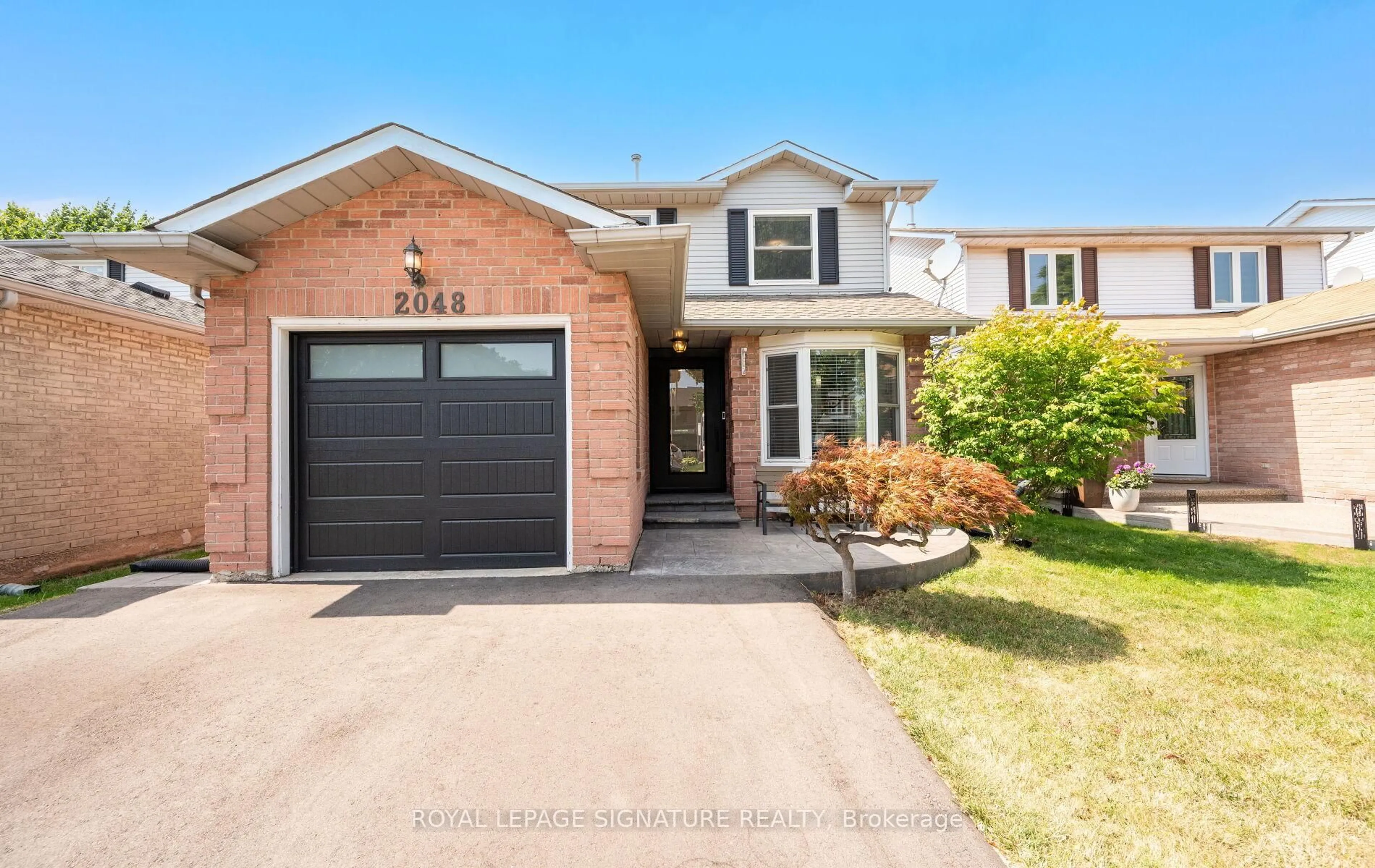 Home with brick exterior material, street for 2048 Chrisdon Rd, Burlington Ontario L7M 3W9