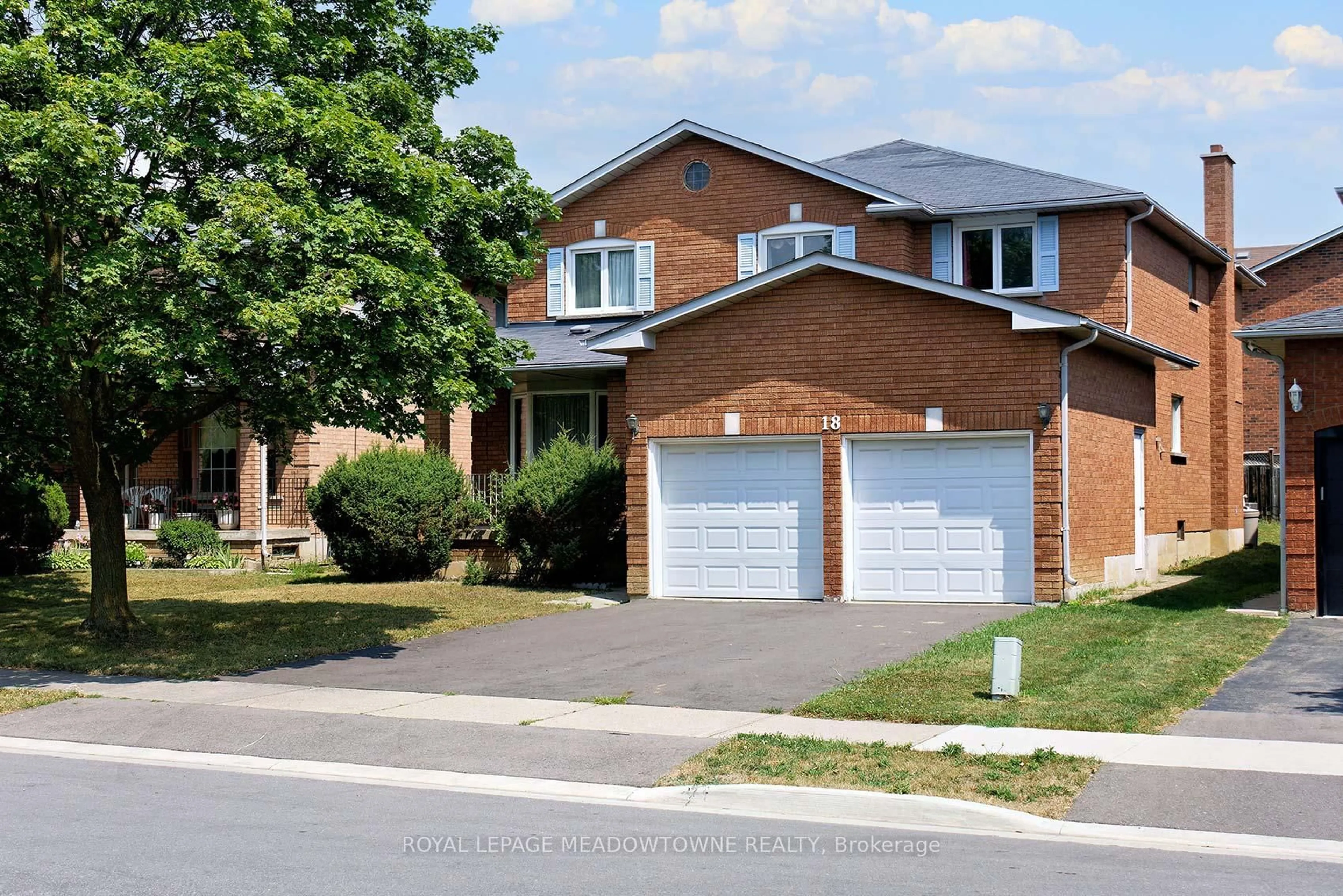 Home with brick exterior material, street for 18 Blue Bonnet Dr, Brampton Ontario L6Y 4N4