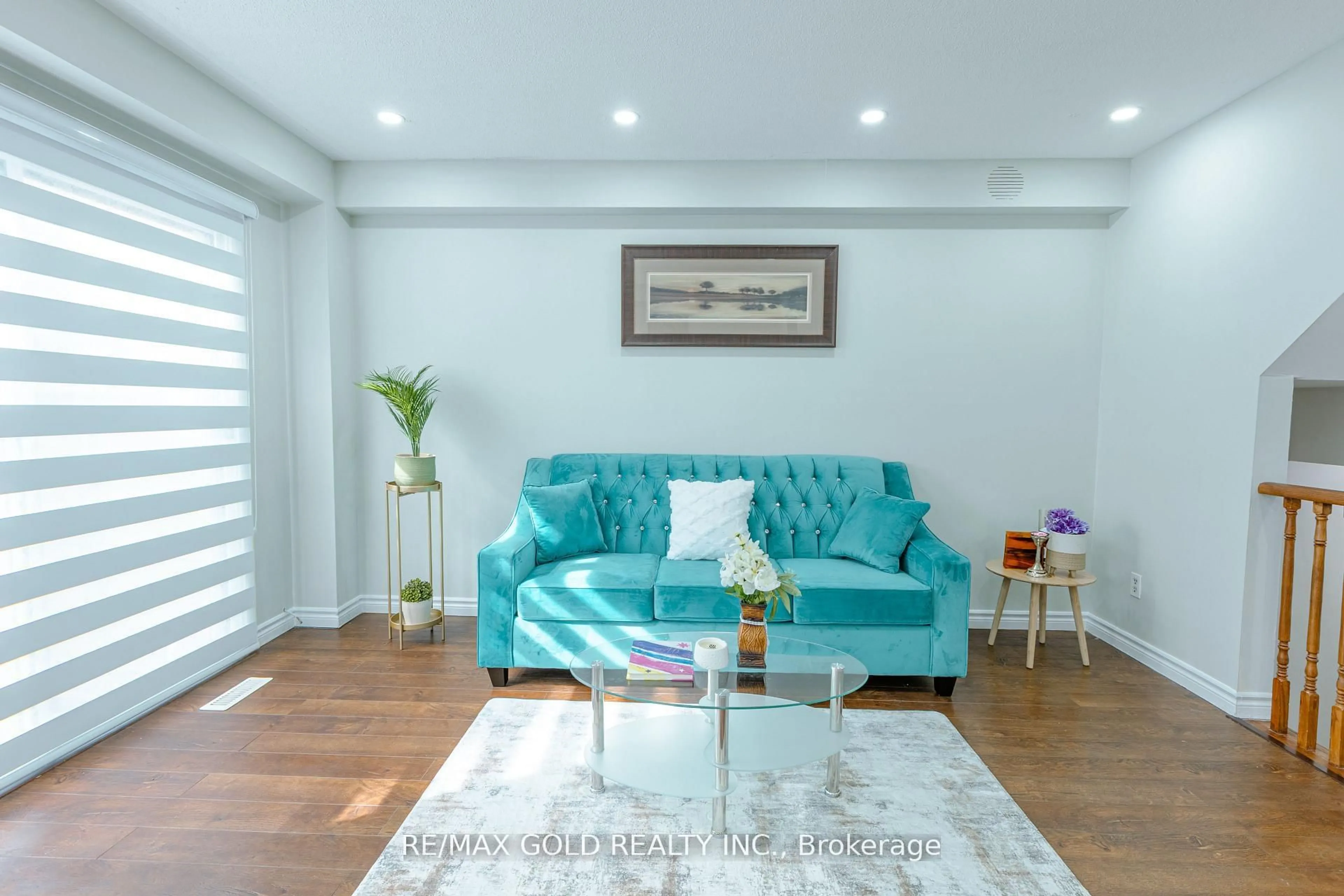 Living room with furniture, wood/laminate floor for 337 Fleetwood Cres, Brampton Ontario L6T 2E7