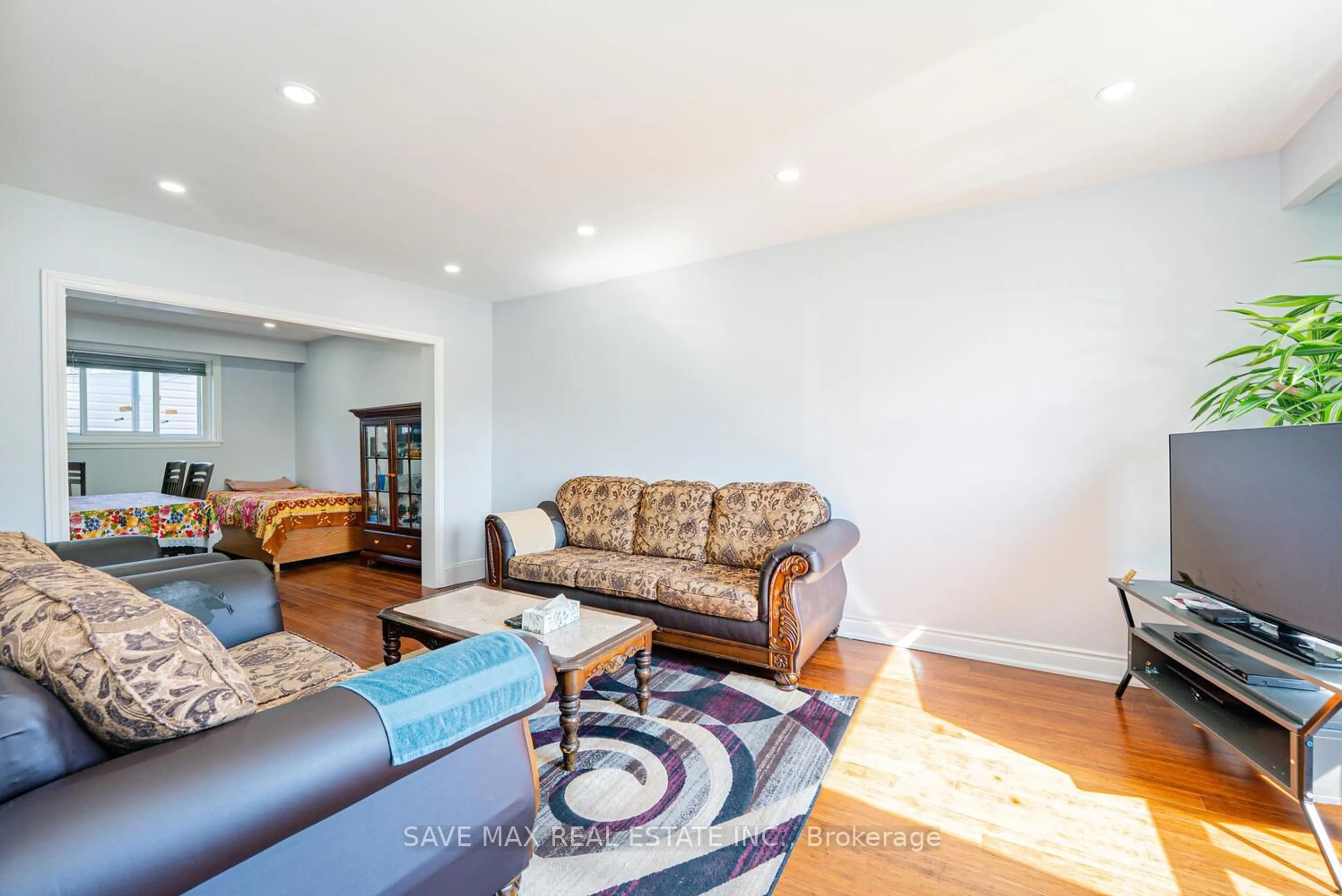 Living room with furniture, wood/laminate floor for 88 Cloverdale Dr, Brampton Ontario L6T 2T8