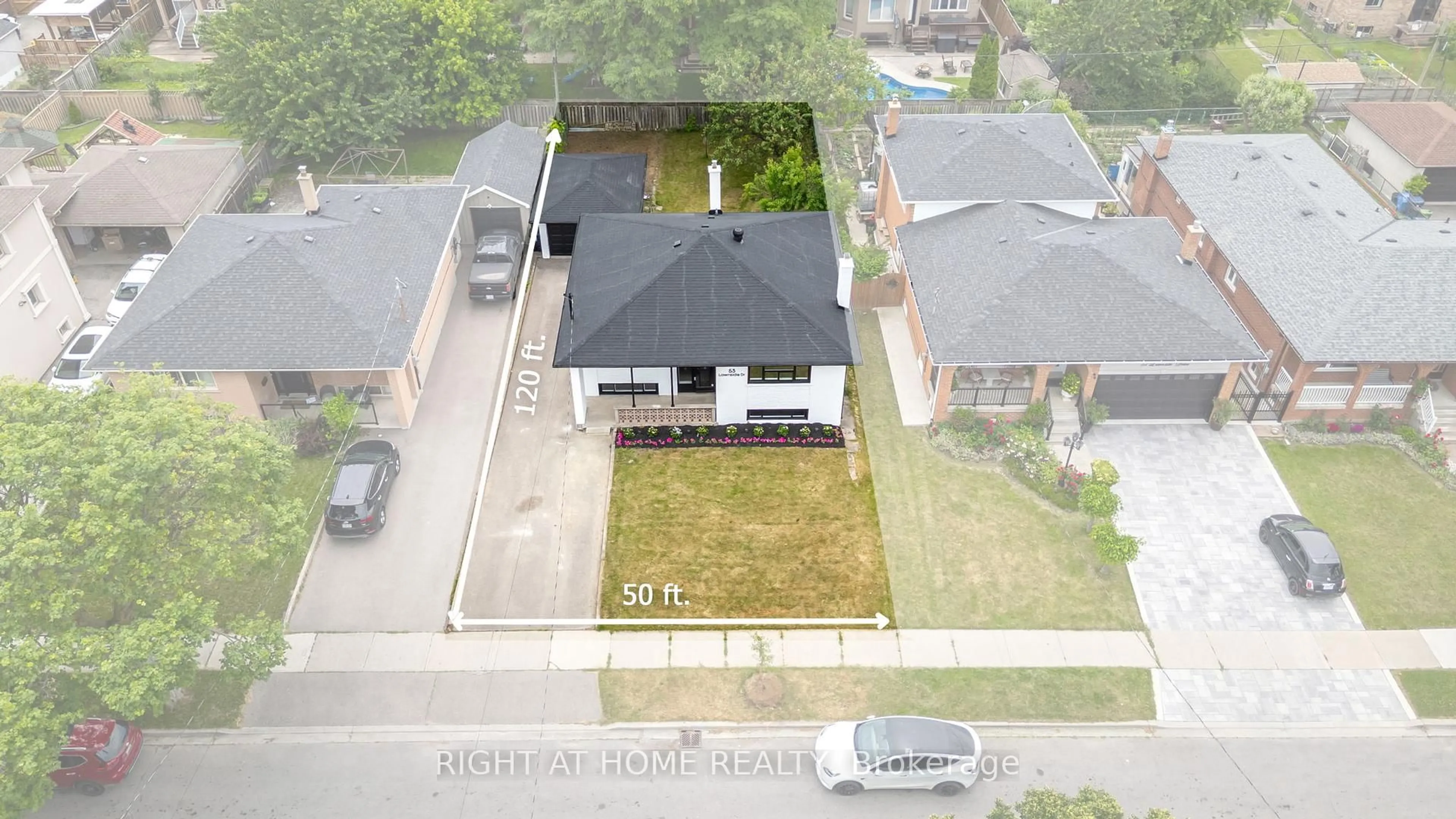 A pic from outside/outdoor area/front of a property/back of a property/a pic from drone, street for 53 Lawnside Dr, Toronto Ontario M6L 1Z4