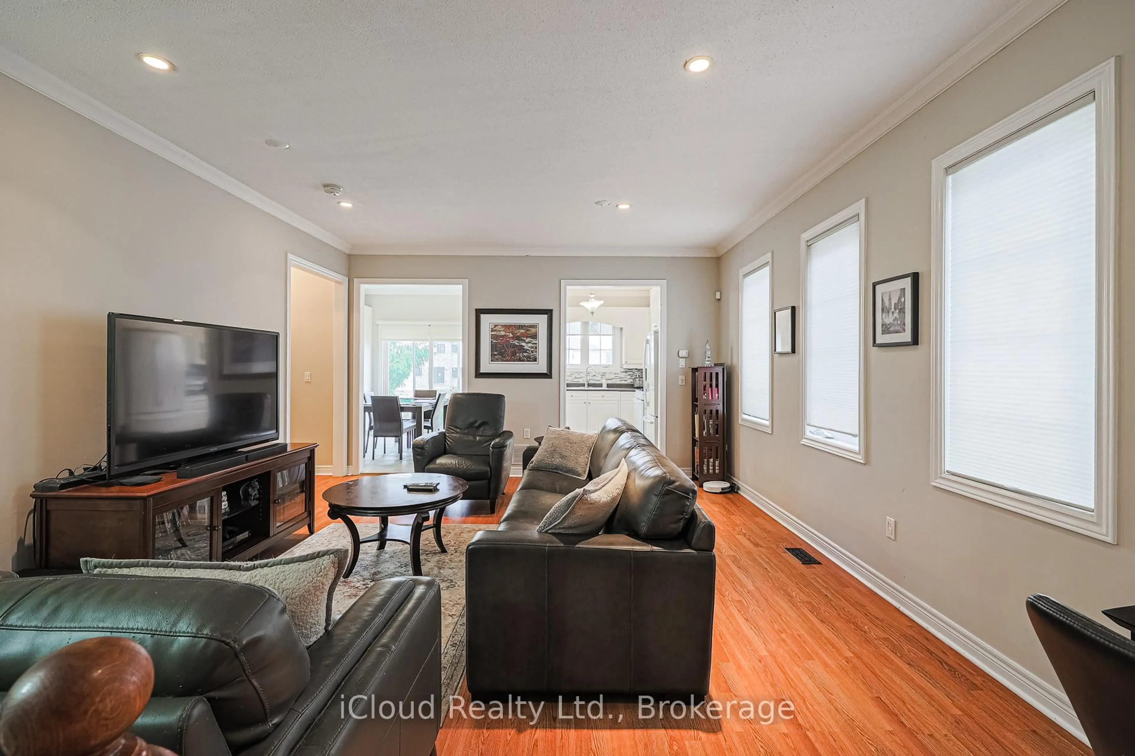 Living room with furniture, wood/laminate floor for 48 Donwoods Crt, Brampton Ontario L6P 1T7