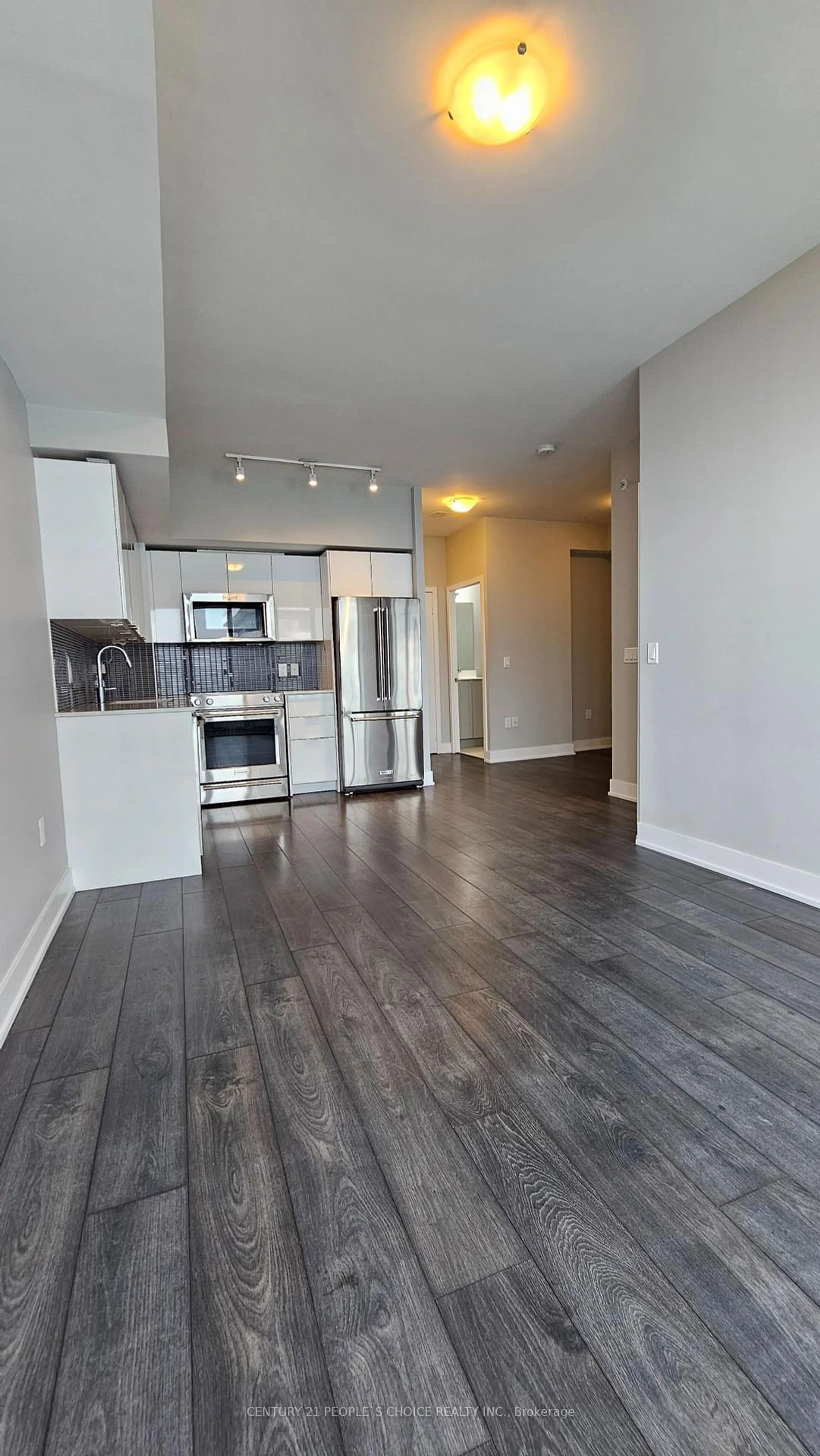 Open concept kitchen, wood/laminate floor for 30 Shore Breeze Dr #4714, Toronto Ontario M8V 0J1