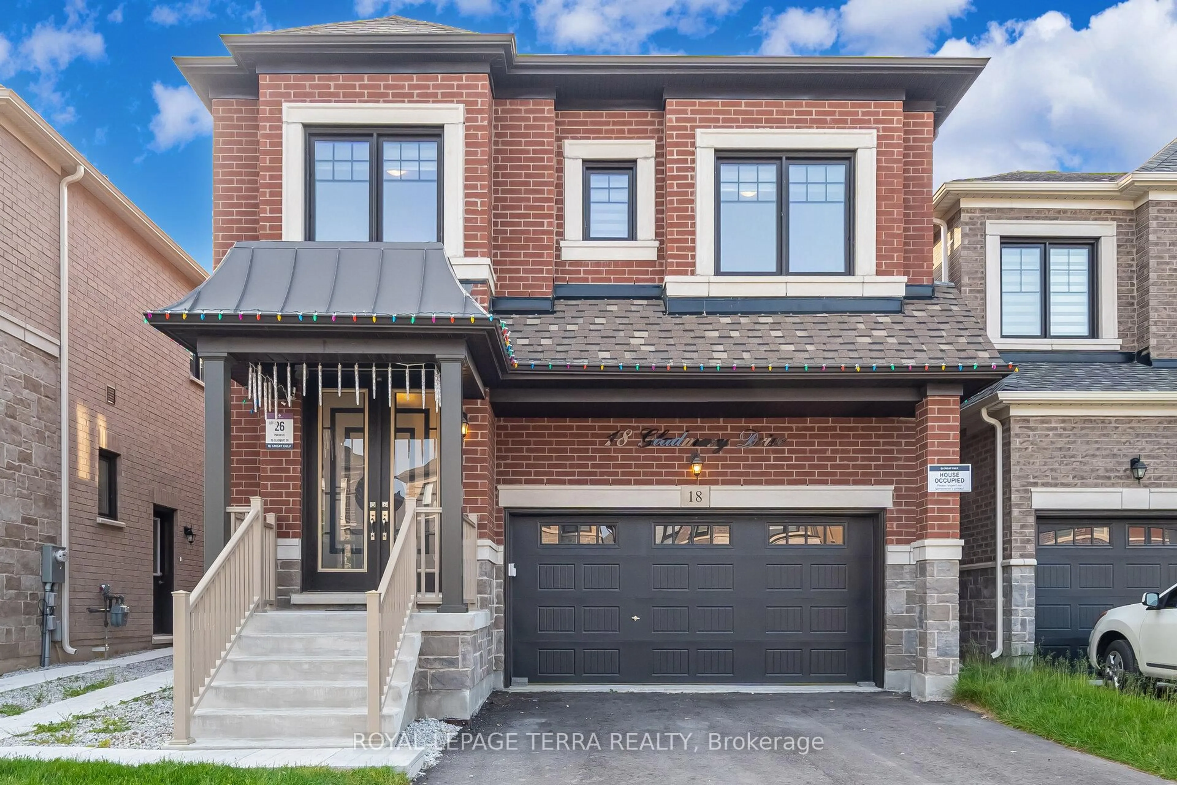 Home with brick exterior material, street for 18 Gladmary Dr, Brampton Ontario L6Y 0E4