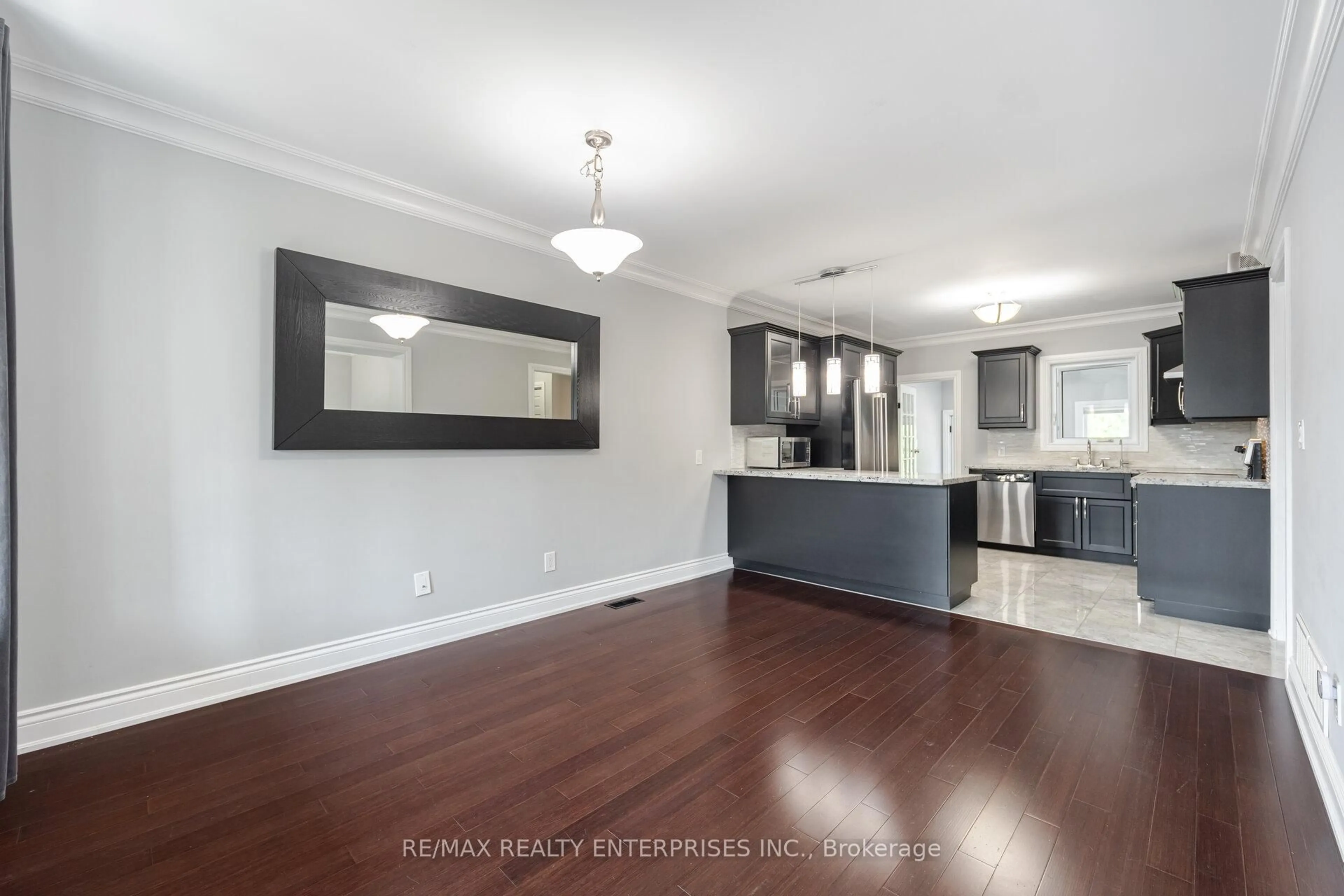 Open concept kitchen, wood/laminate floor for 96 Manitoba St, Toronto Ontario M8Y 1C9