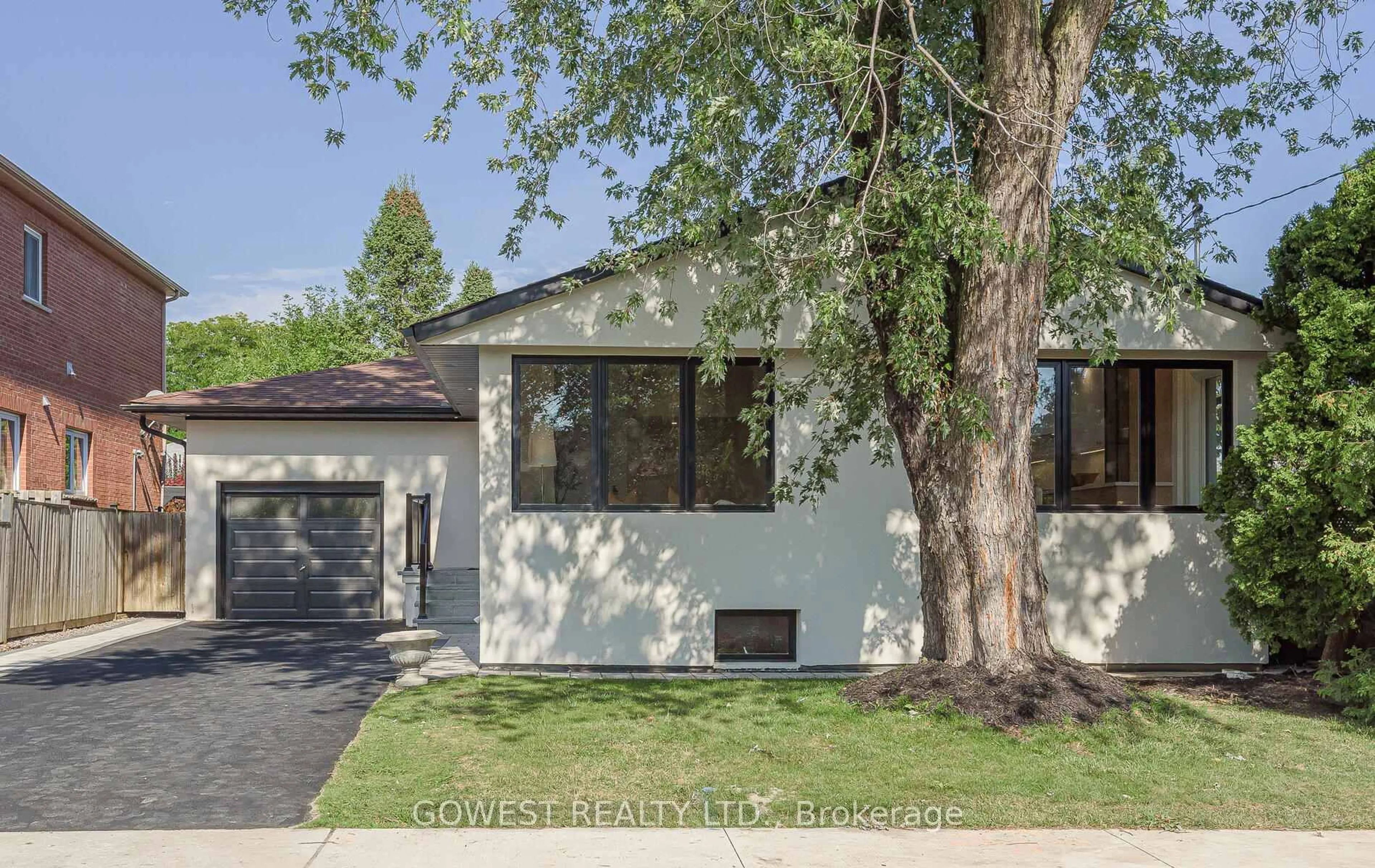 Home with brick exterior material, street for 28 Allonsius Dr, Toronto Ontario M9C 3N5