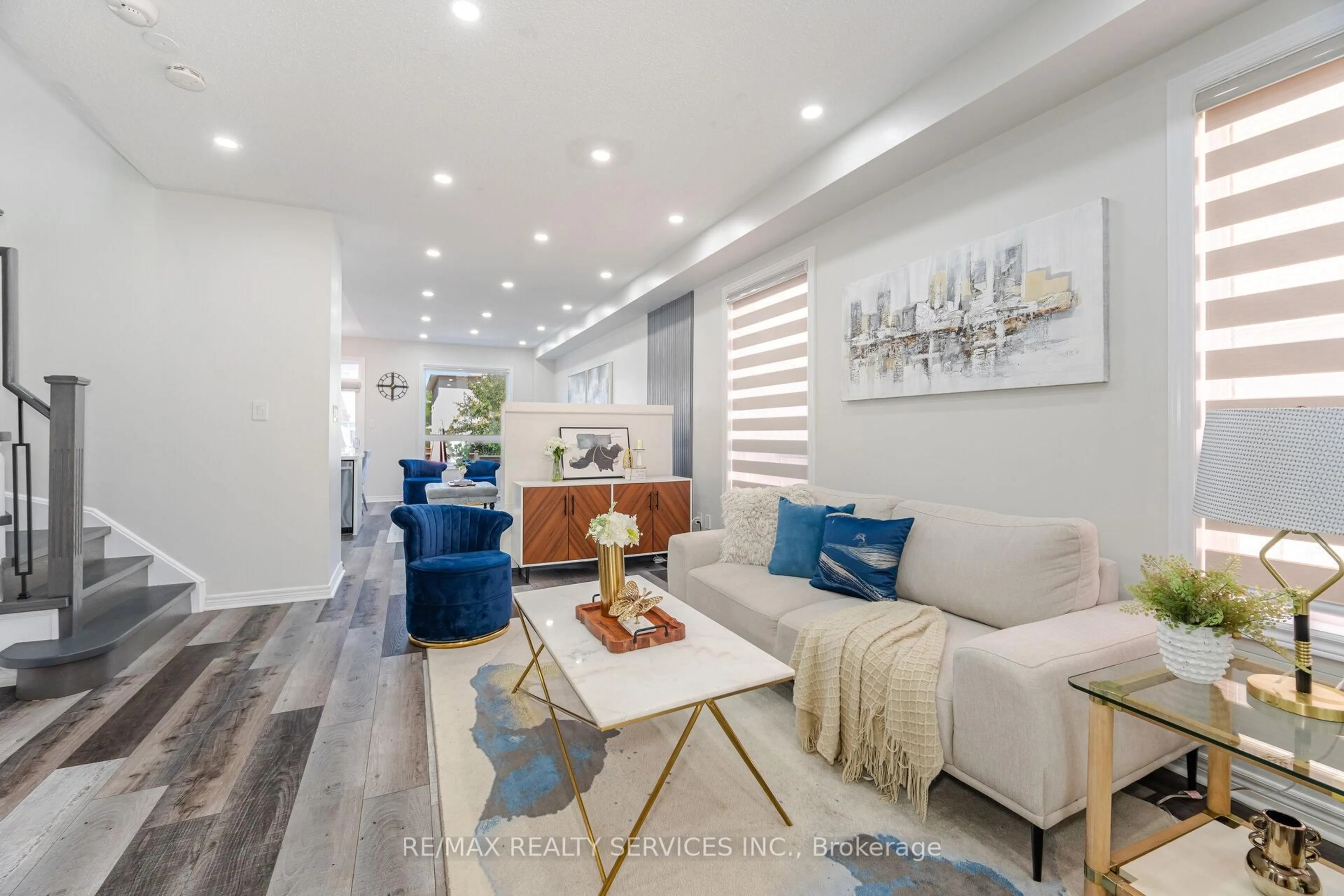 Living room with furniture, wood/laminate floor for 10 Martree Cres, Brampton Ontario L6V 4R2