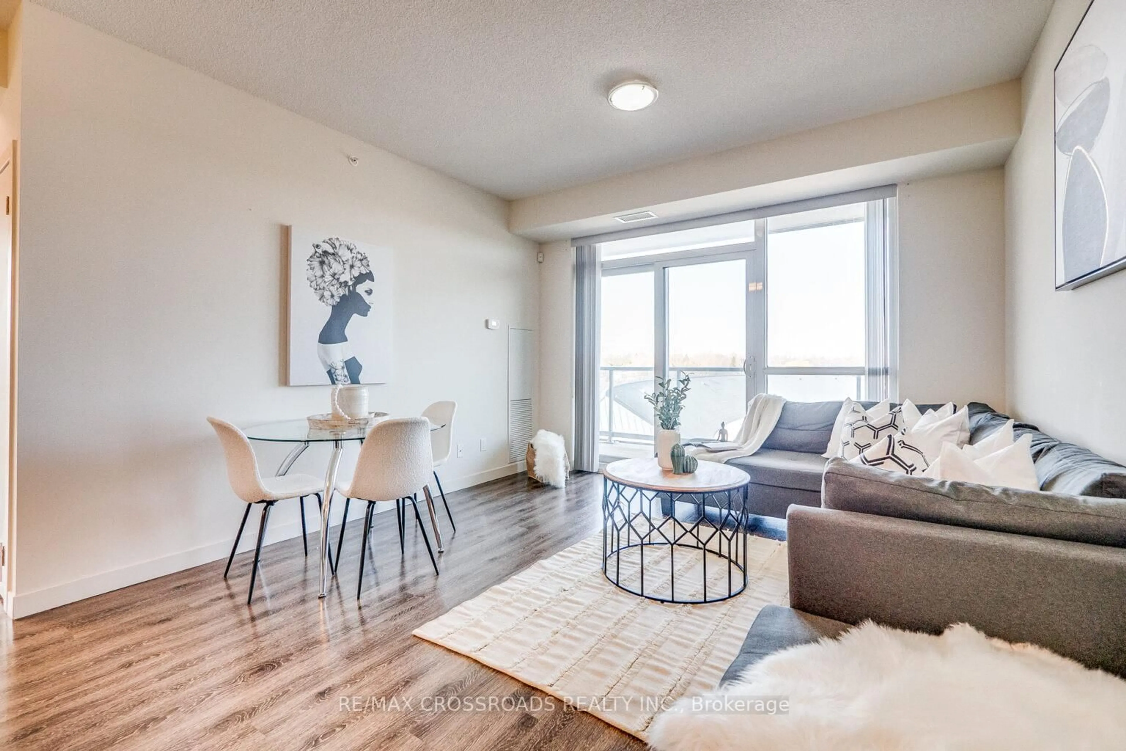 Living room with furniture, wood/laminate floor for 2093 Fairview St #502, Burlington Ontario L7R 0E6