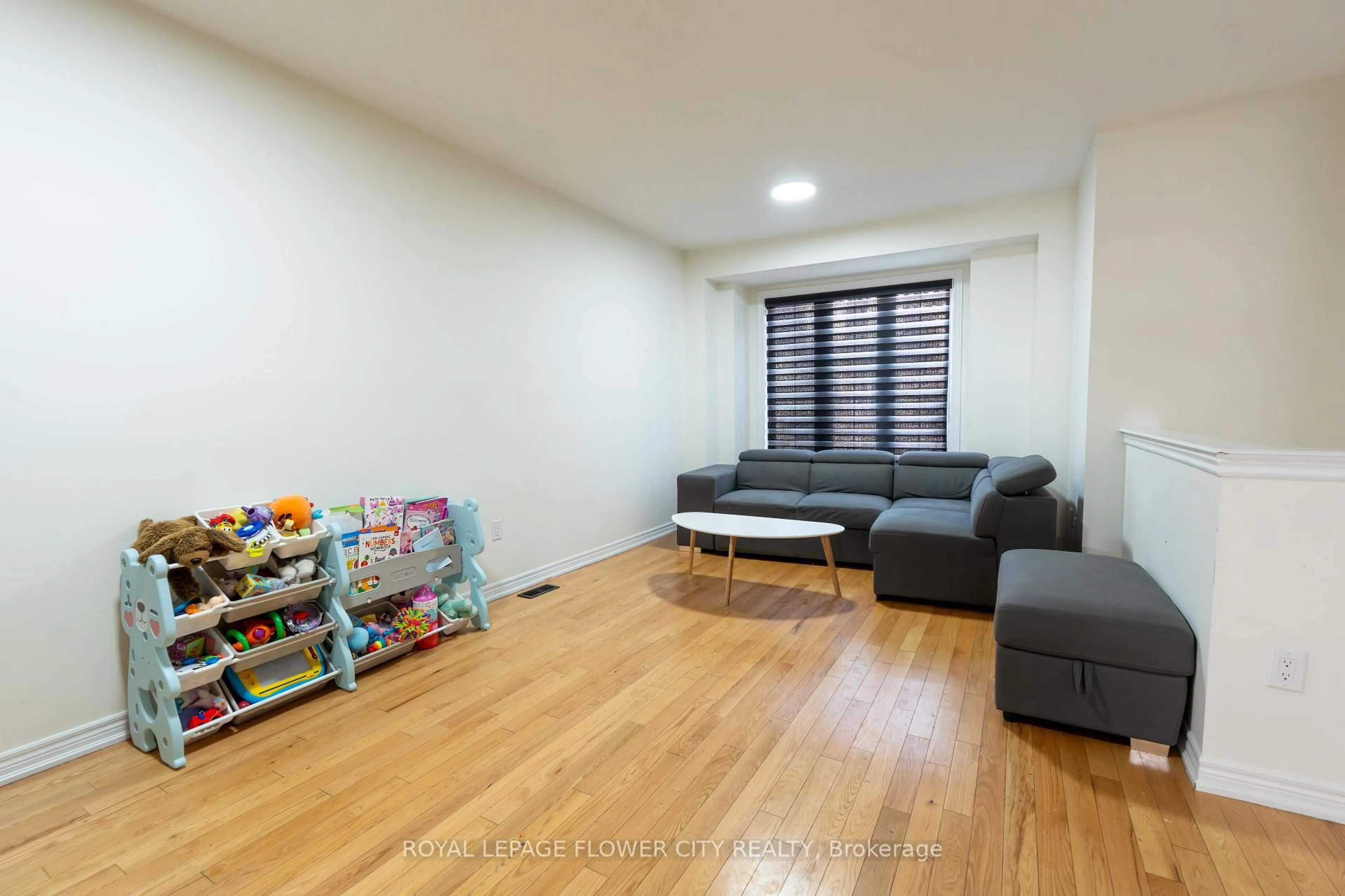 Living room with furniture, wood/laminate floor for 15 Sea Drifter Cres, Brampton Ontario L6P 4A9