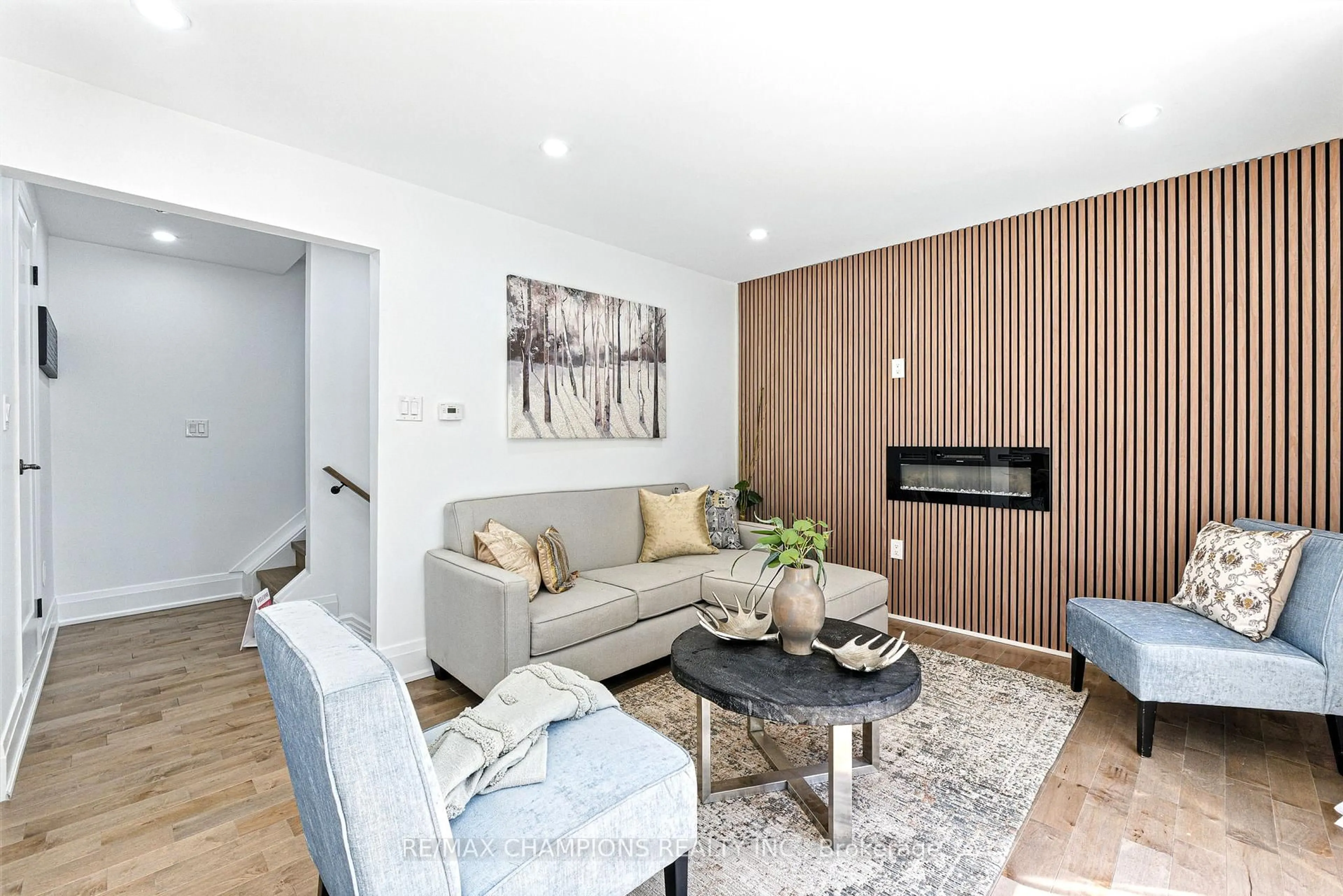 Living room with furniture, wood/laminate floor for 35 Hercules Crt, Brampton Ontario L6S 1X6