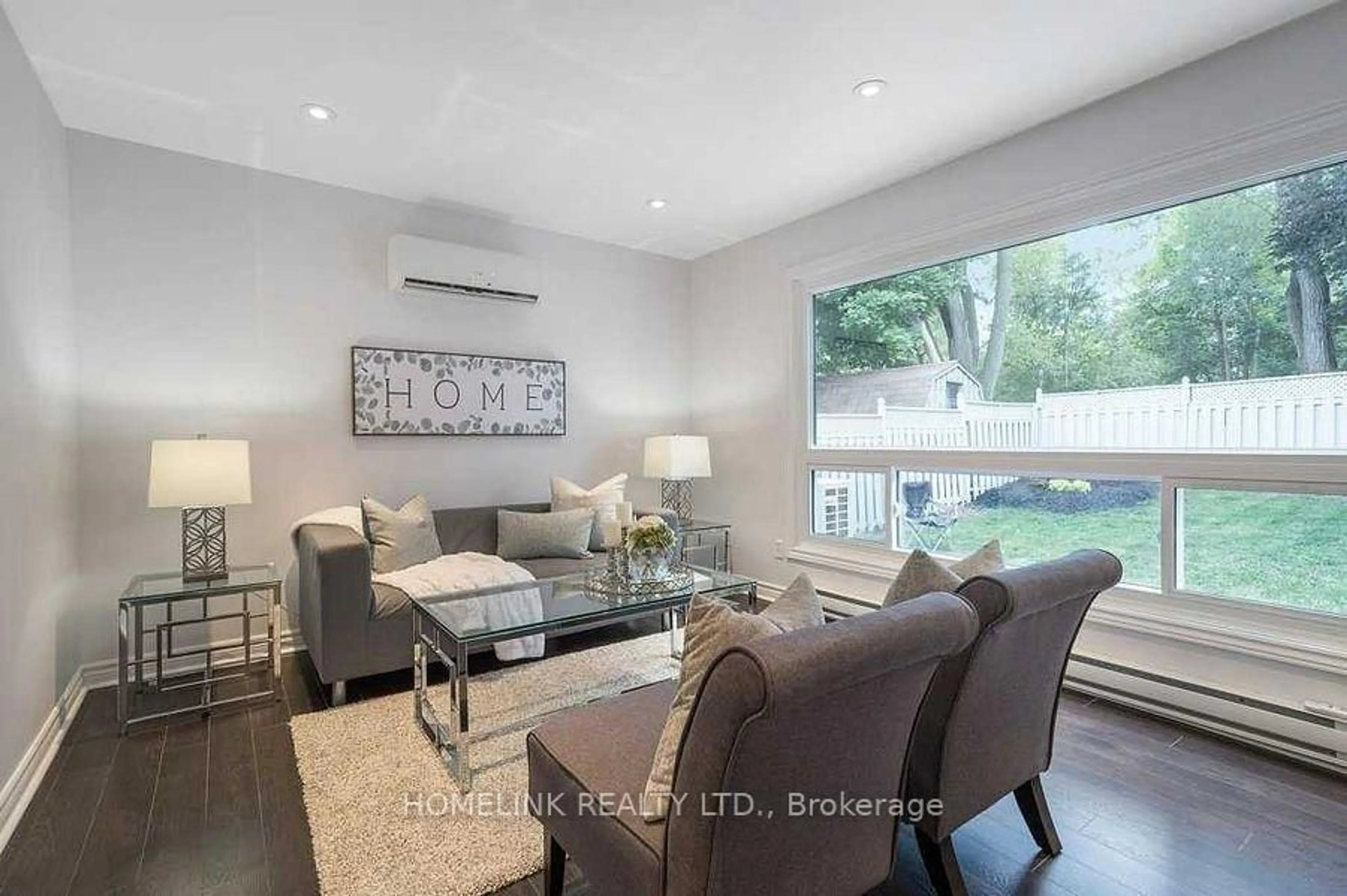 Living room with furniture, wood/laminate floor for 25 Hercules Crt, Brampton Ontario L6S 1X6