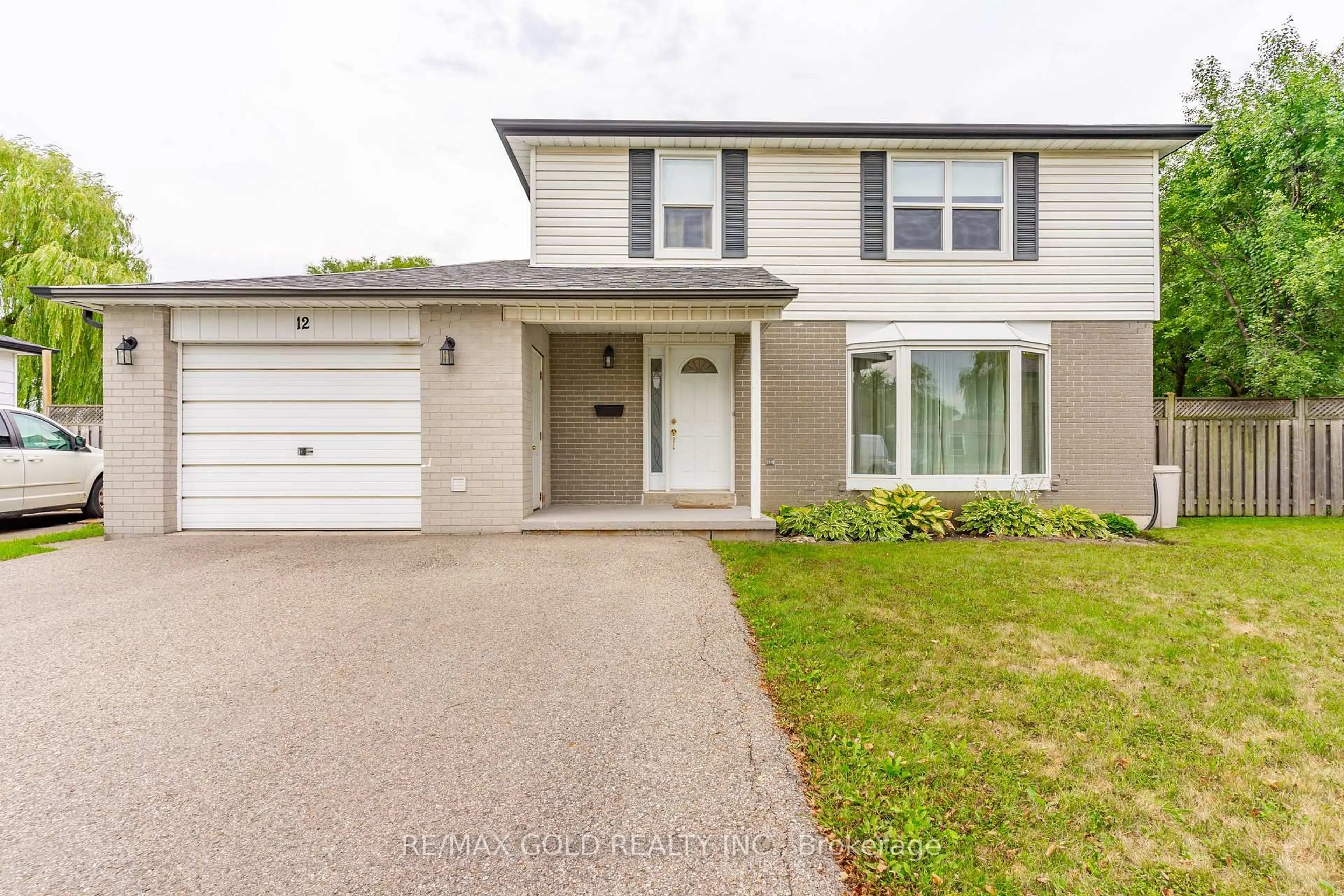 Home with vinyl exterior material, street for 12 Dunblaine Cres, Brampton Ontario L6T 3H2
