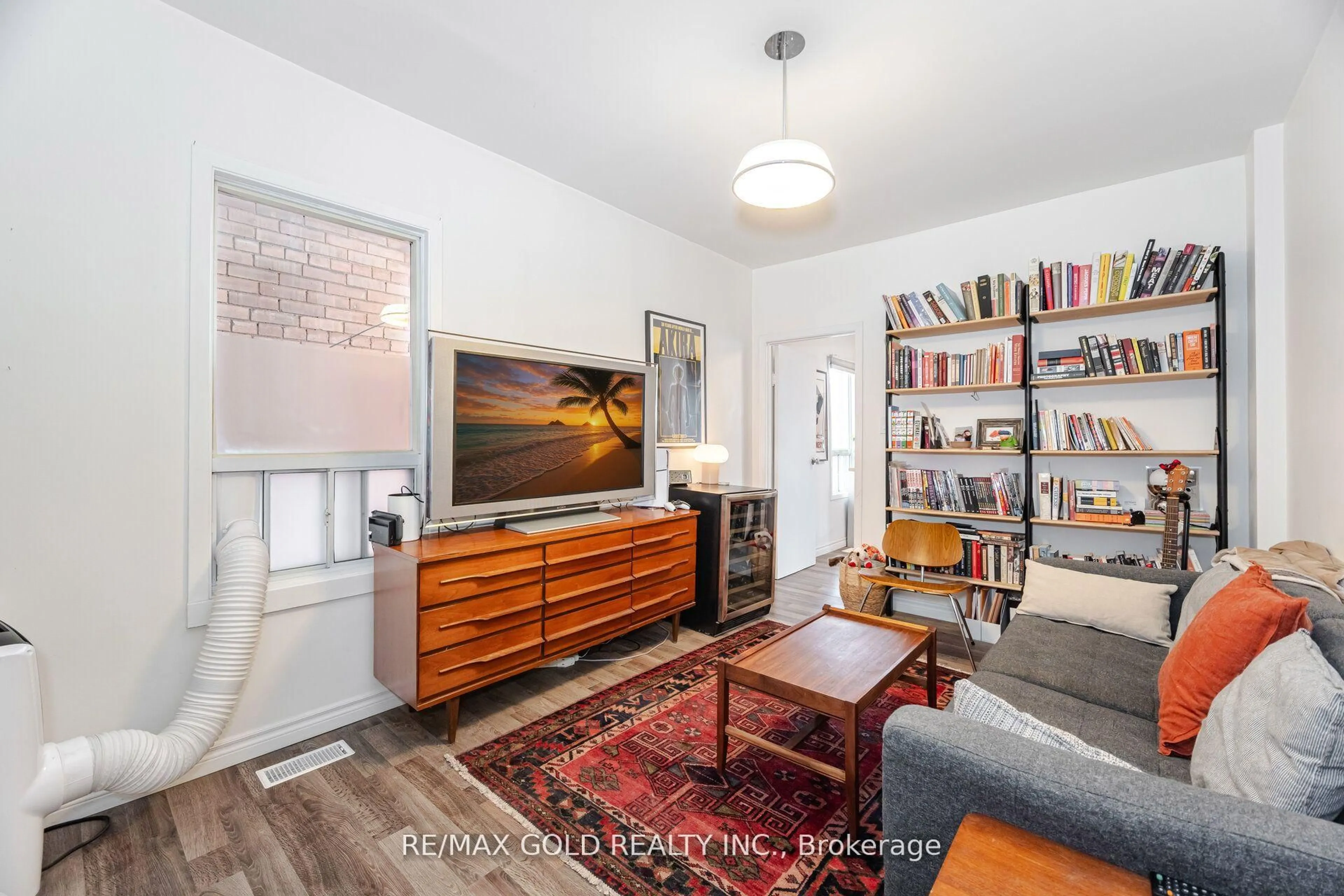 Living room with furniture, wood/laminate floor for 60 Salem Ave, Toronto Ontario M6H 3C1