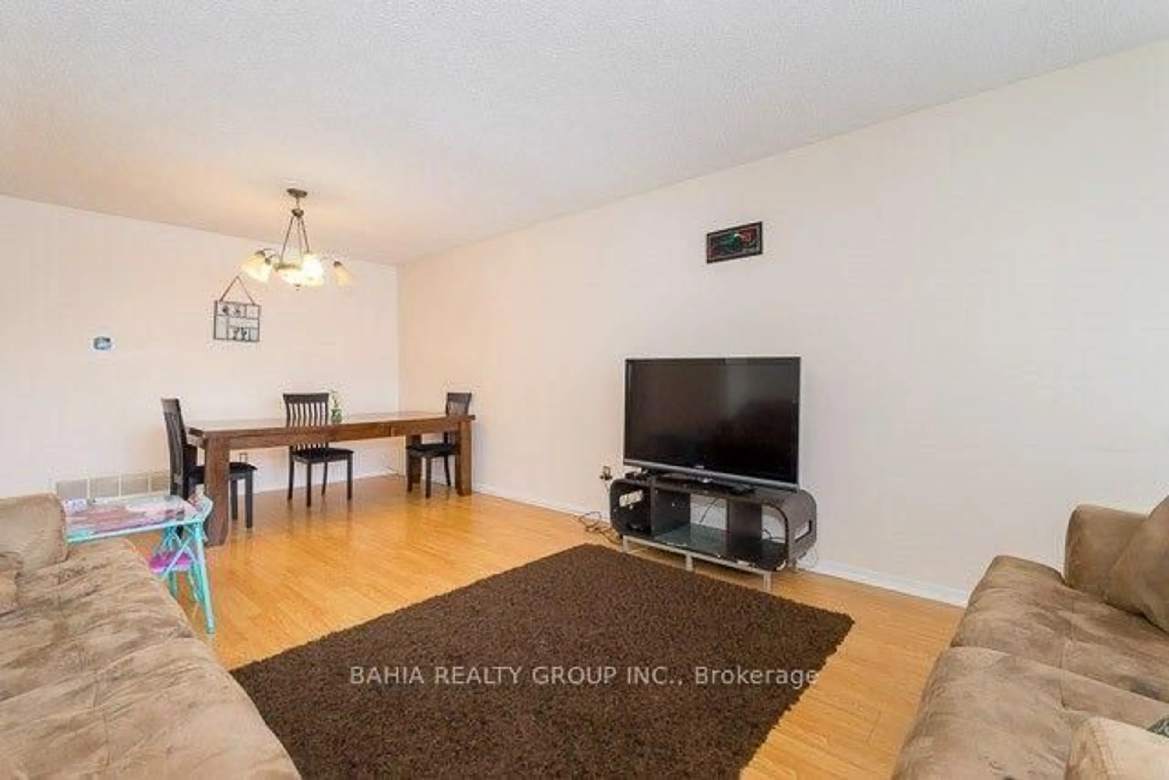 Living room with furniture, wood/laminate floor for 14 Newlyn Cres, Brampton Ontario L6V 3A7